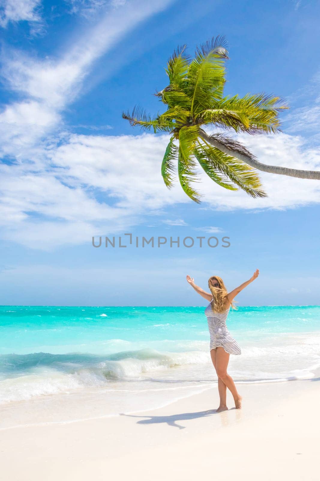 Blonde woman on the tropical beach