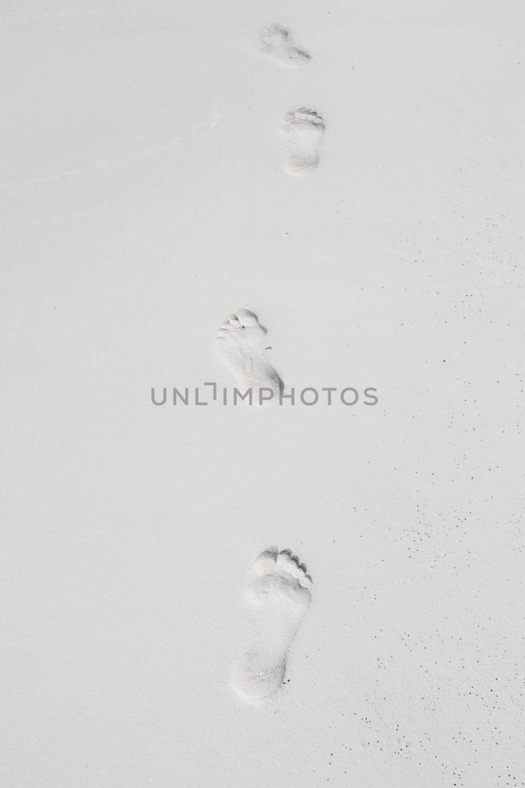Human footprints by the sea