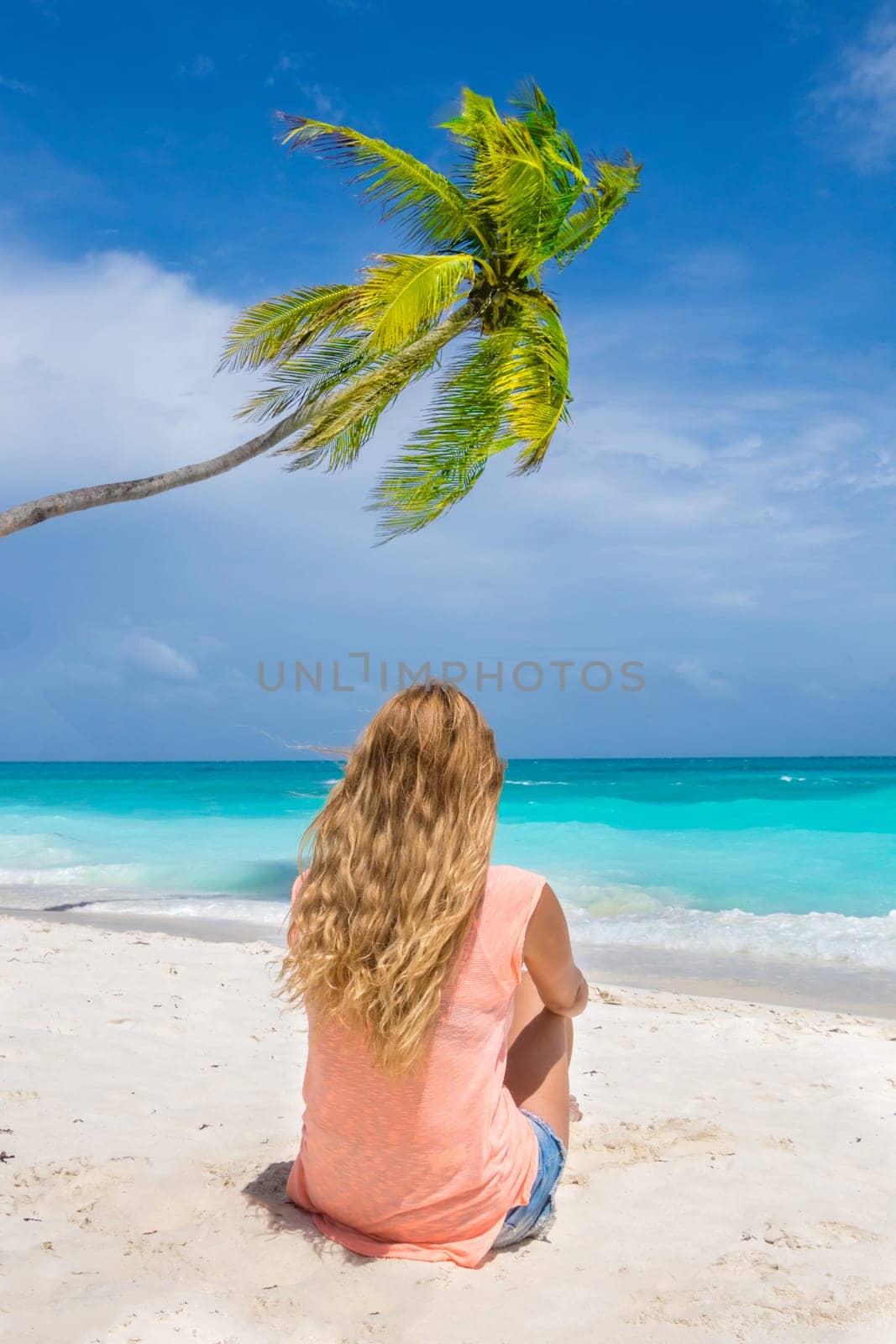 Blonde woman on the tropical beach