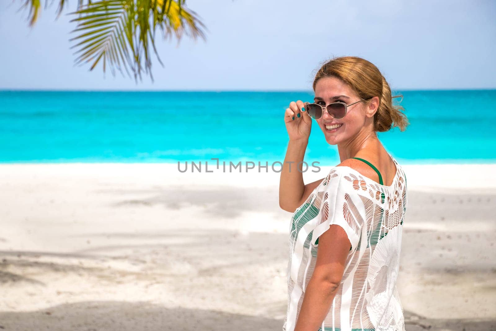 Blonde woman on the tropical beach