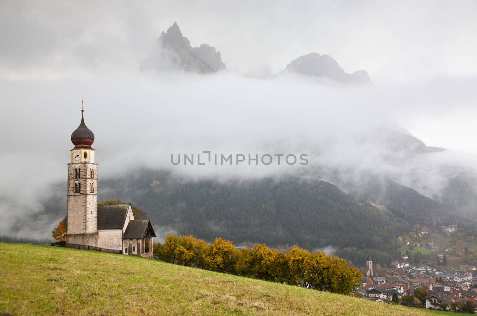 san Valentino church on a foggy late autumn day, Siusi allo Sciliar, Castelrotto, Dolomites, Italy