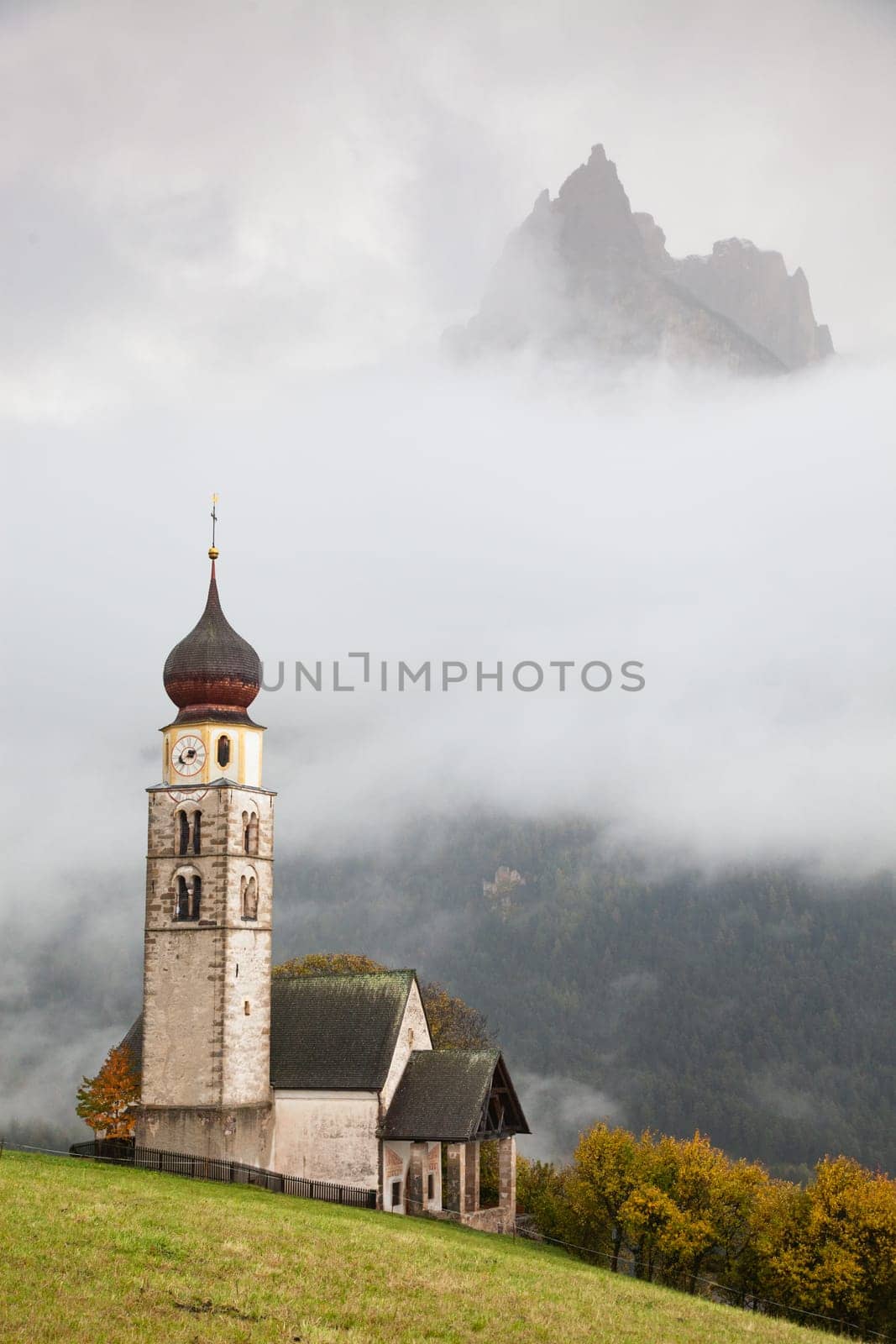 san Valentino church on a foggy late autumn day, Siusi allo Sciliar, Castelrotto, Dolomites, Italy