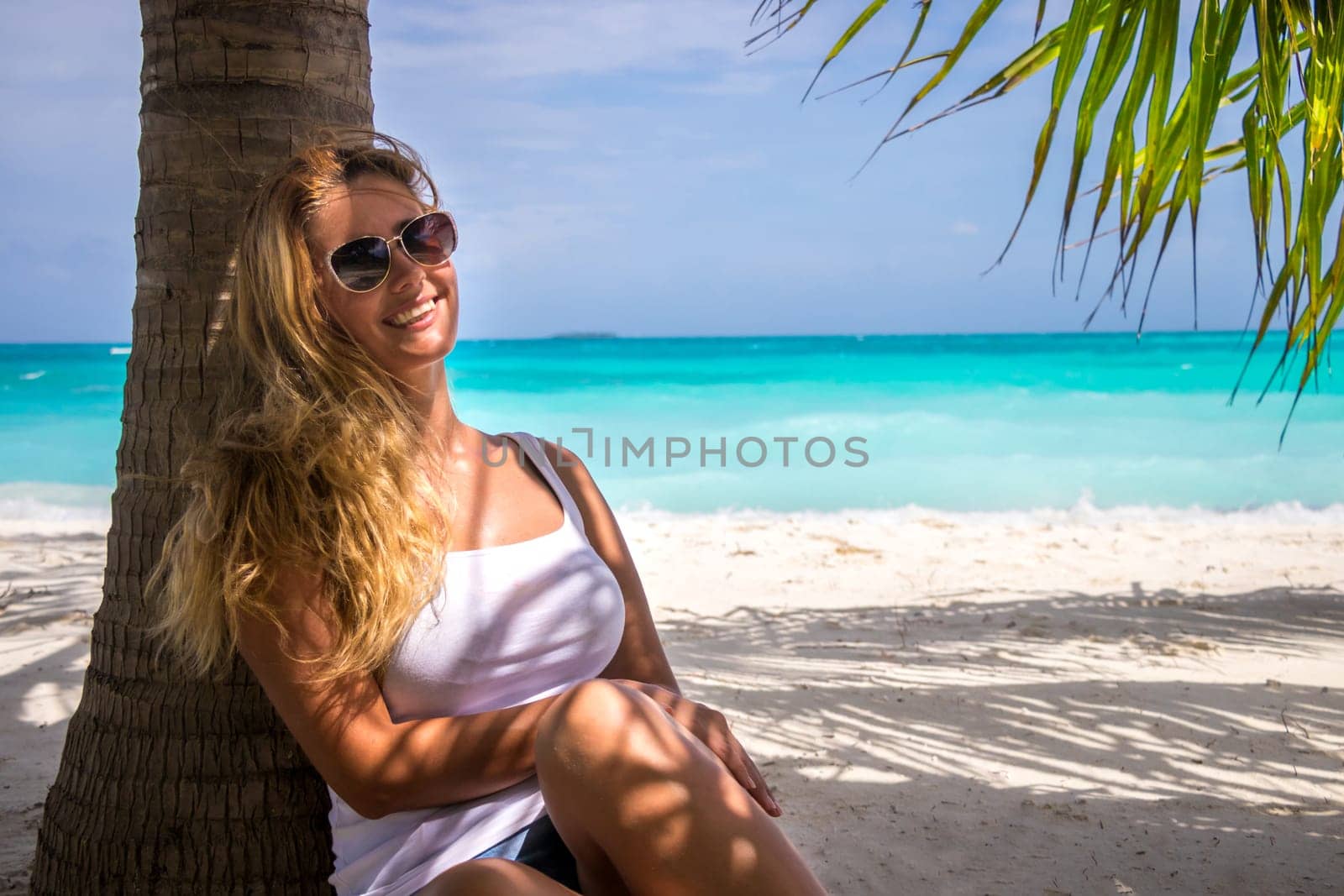 Blonde woman on the tropical beach