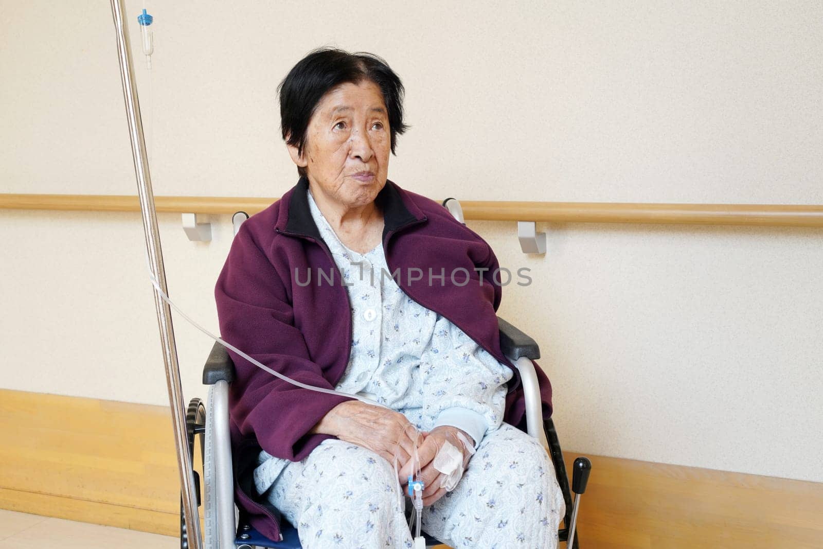 Senior or elderly woman patient on wheelchair so sad in hospital