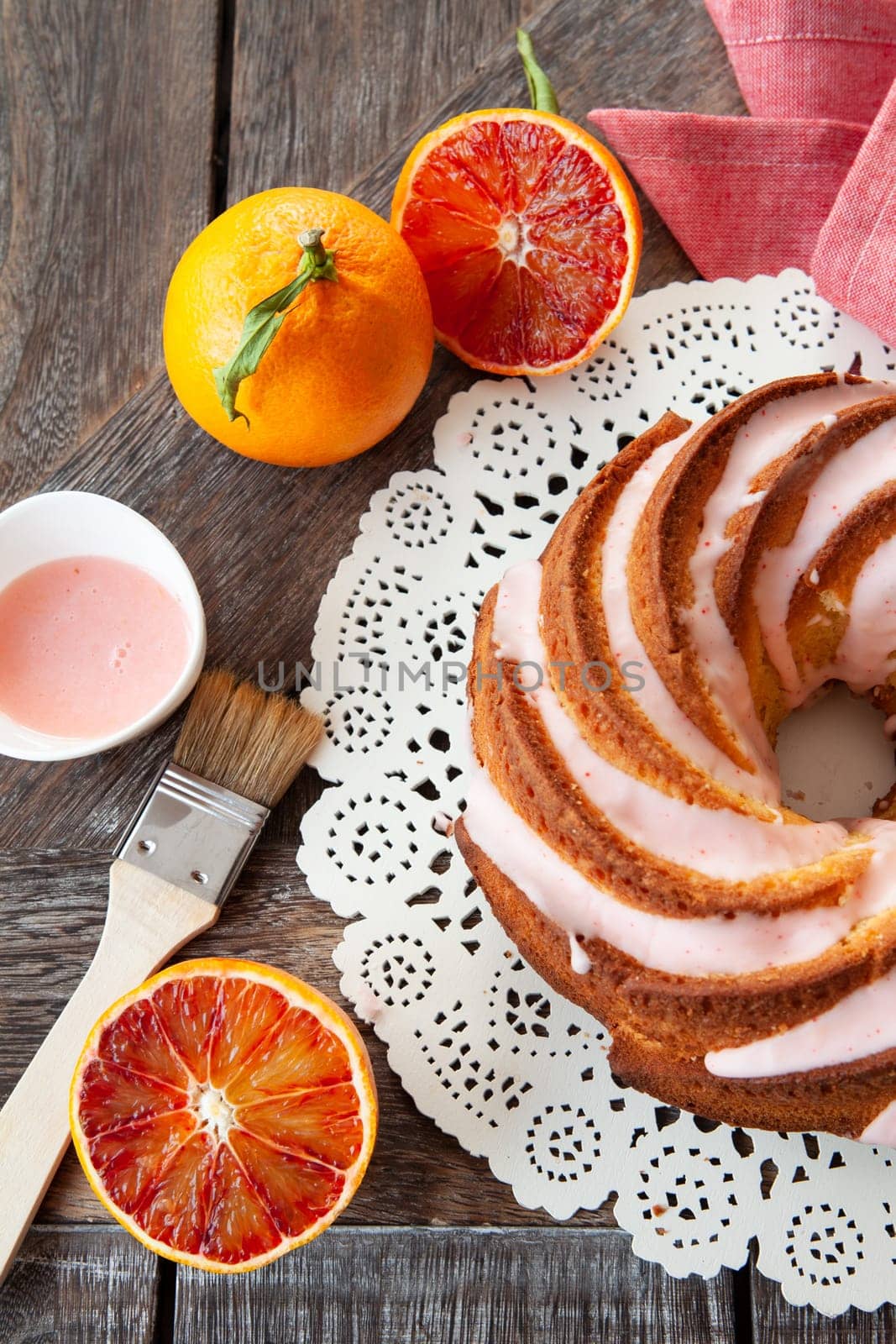 Yummy bundt cake with blood oranges and pink frosting
