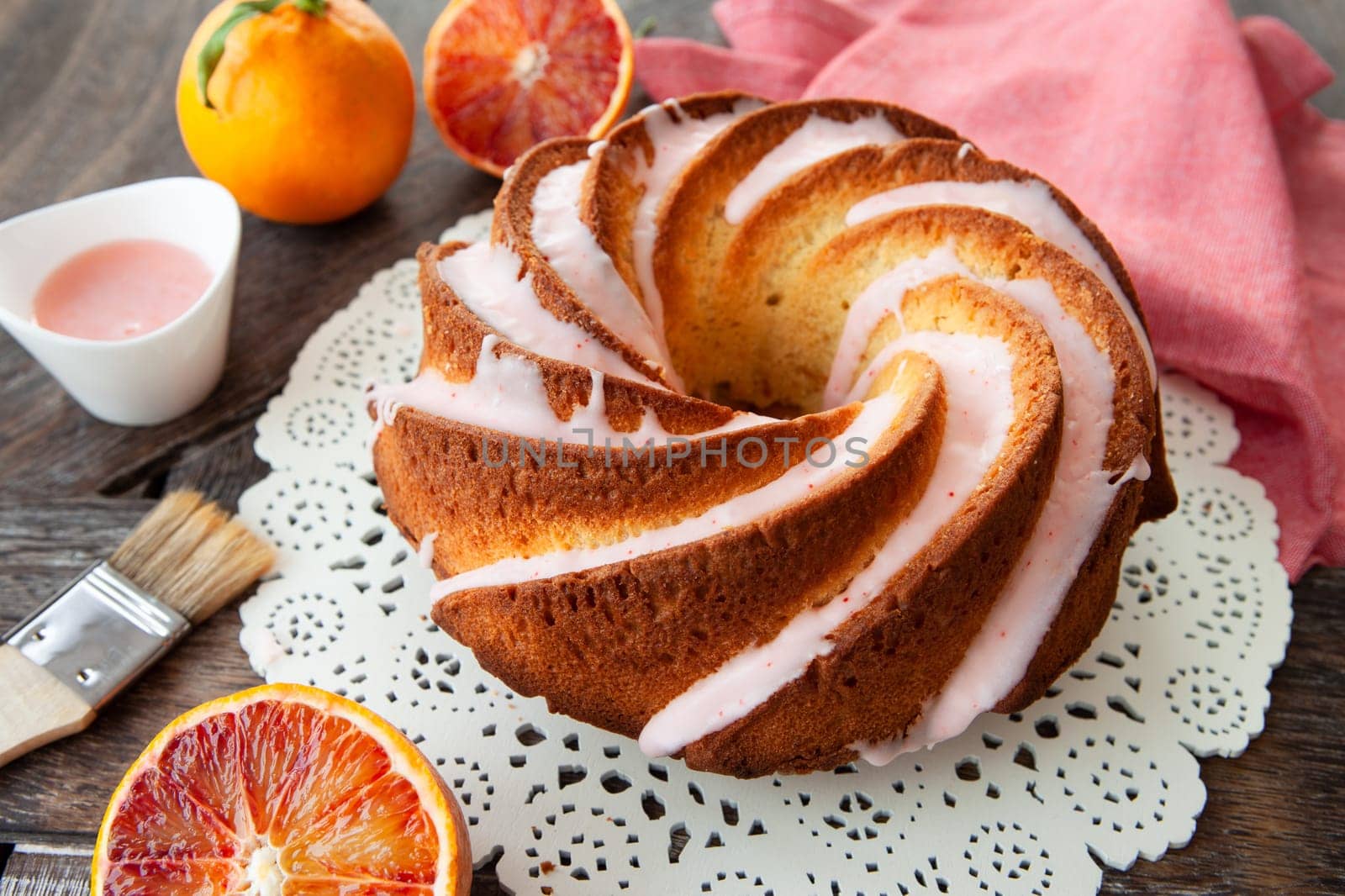 Yummy bundt cake with blood oranges and pink frosting
