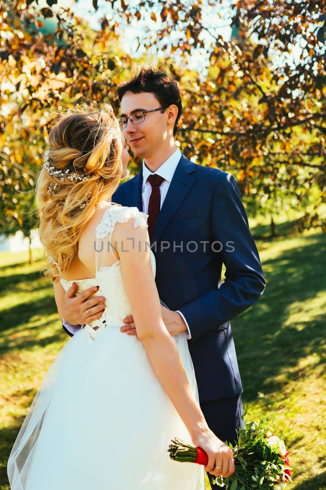 bride and groom on background summer forest.