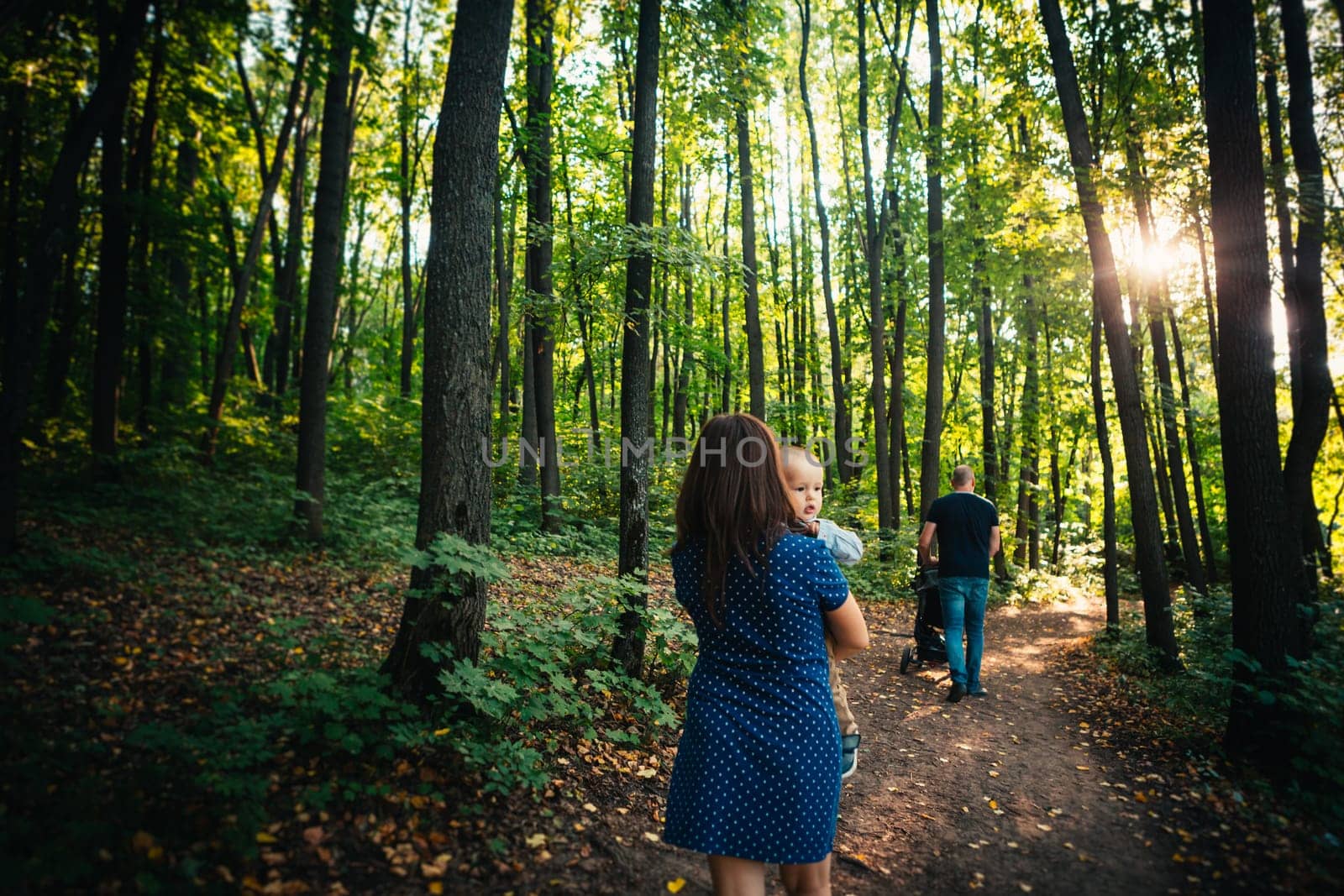 happy family with son on background forest