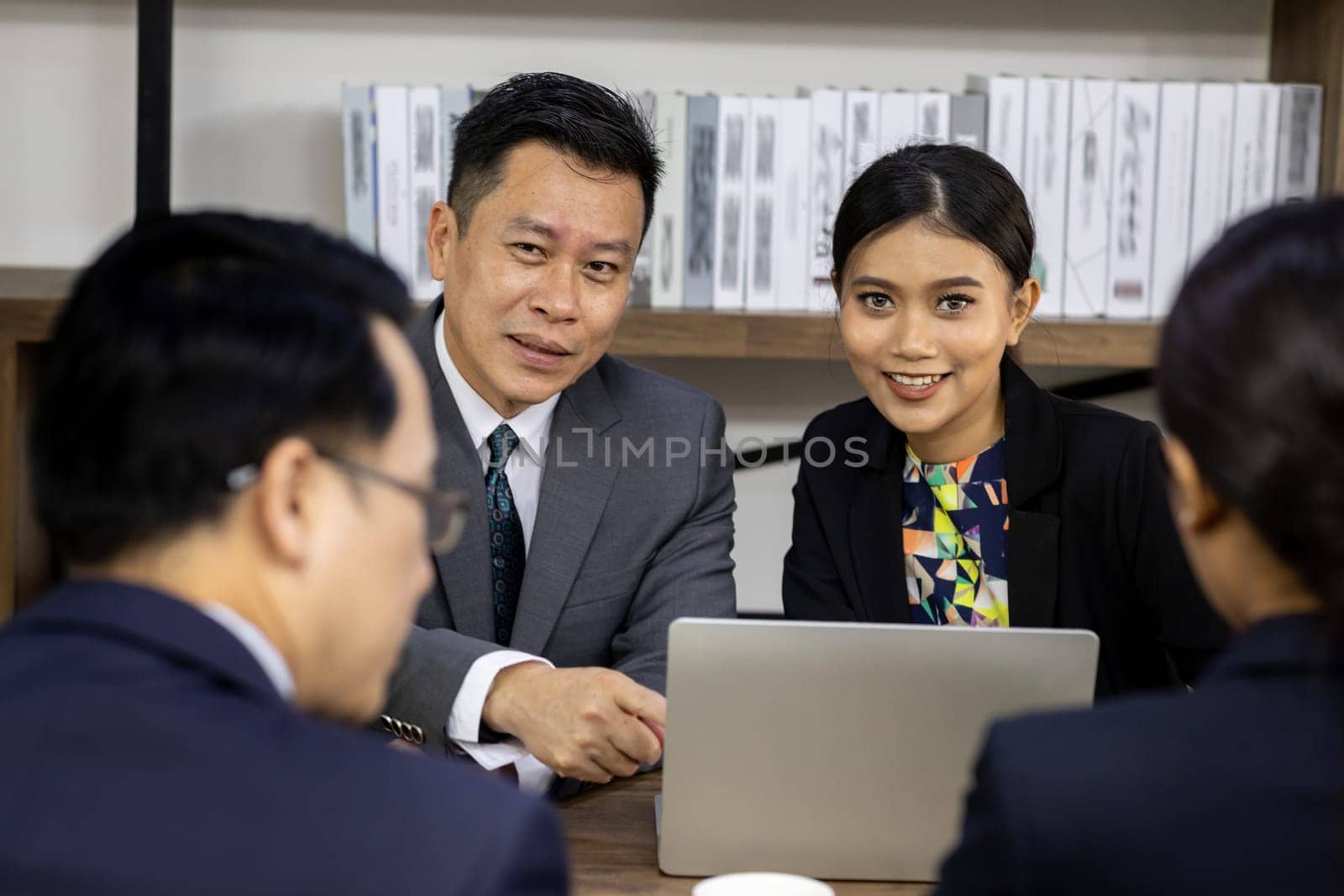 Business team have a meeting in a cafe