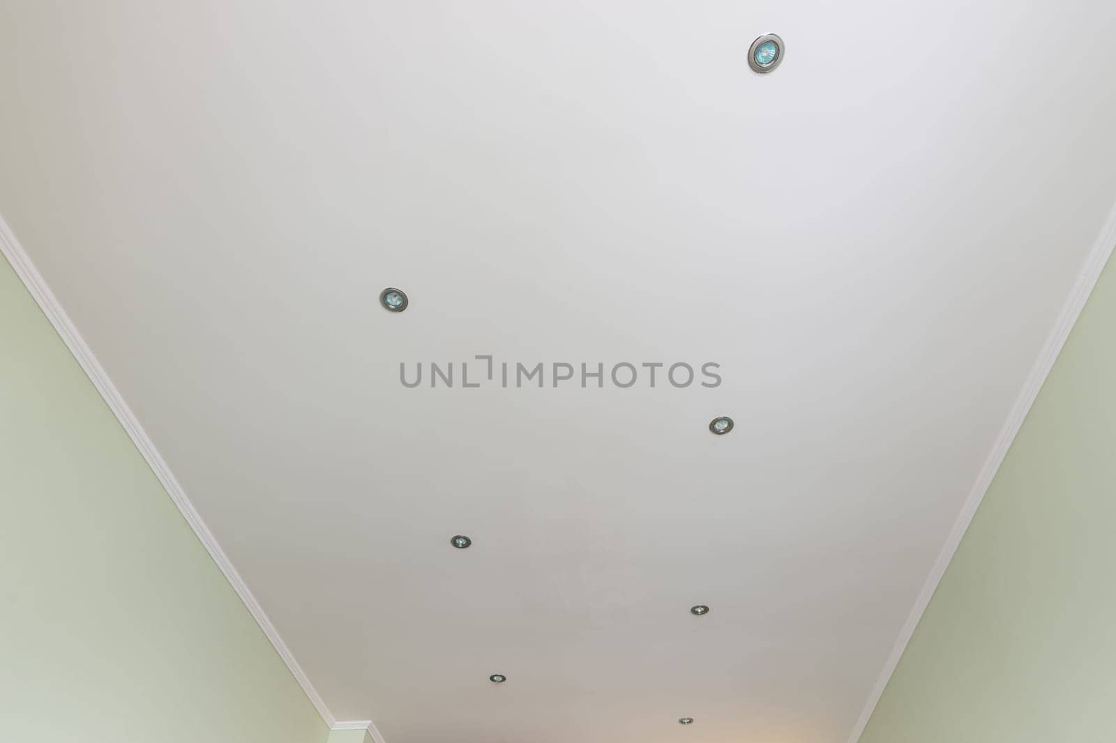 Flattened ceiling in the room, with spotlights installed