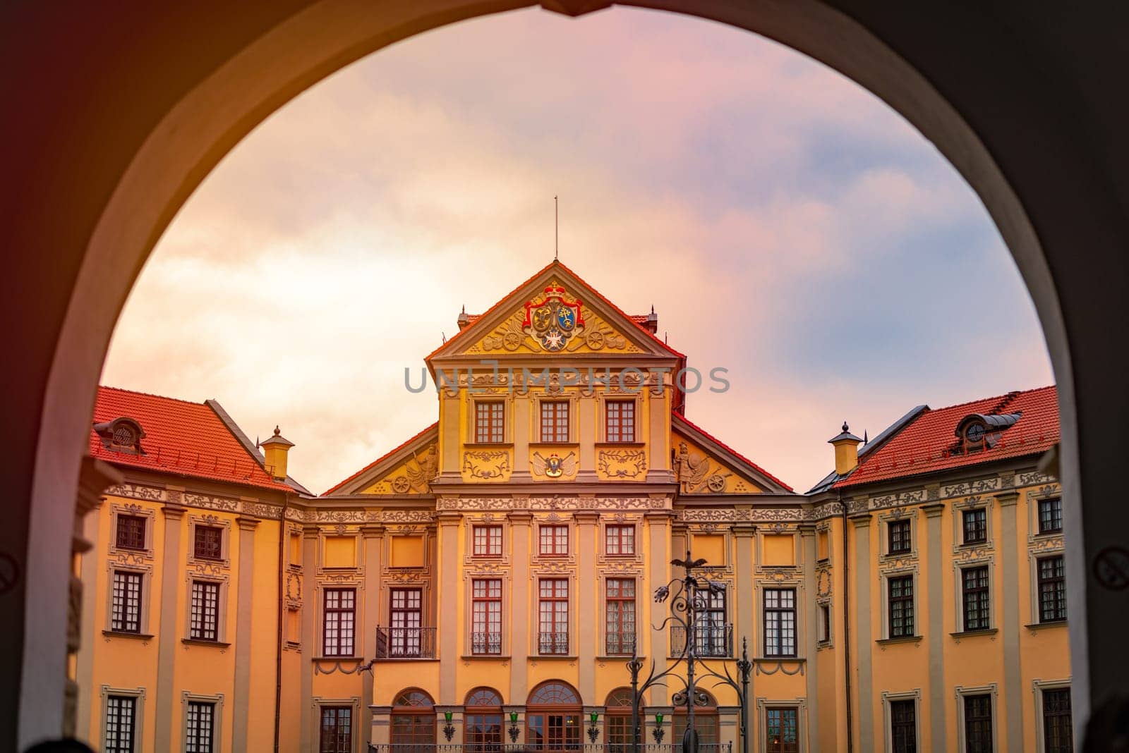 Old medieval castle in Nesvizh, Belarus, Europe. Landmark with sunset cloudy sky in background. Architecture and travel.