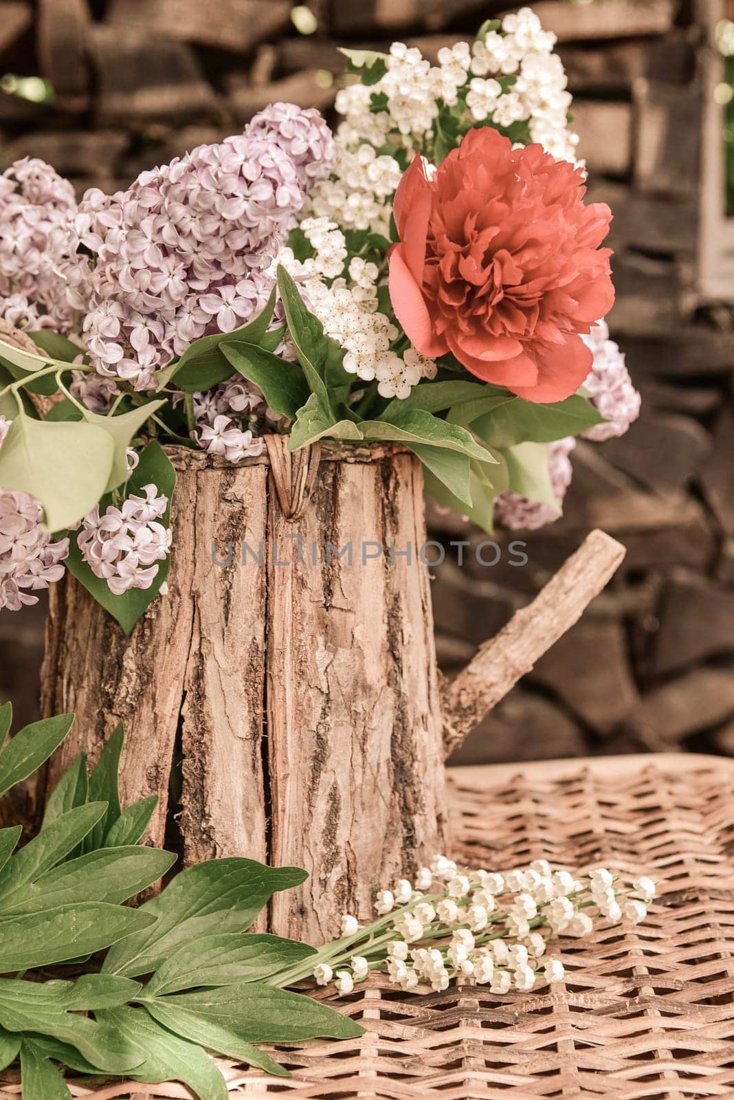Bouquet with lilac and peony roses.