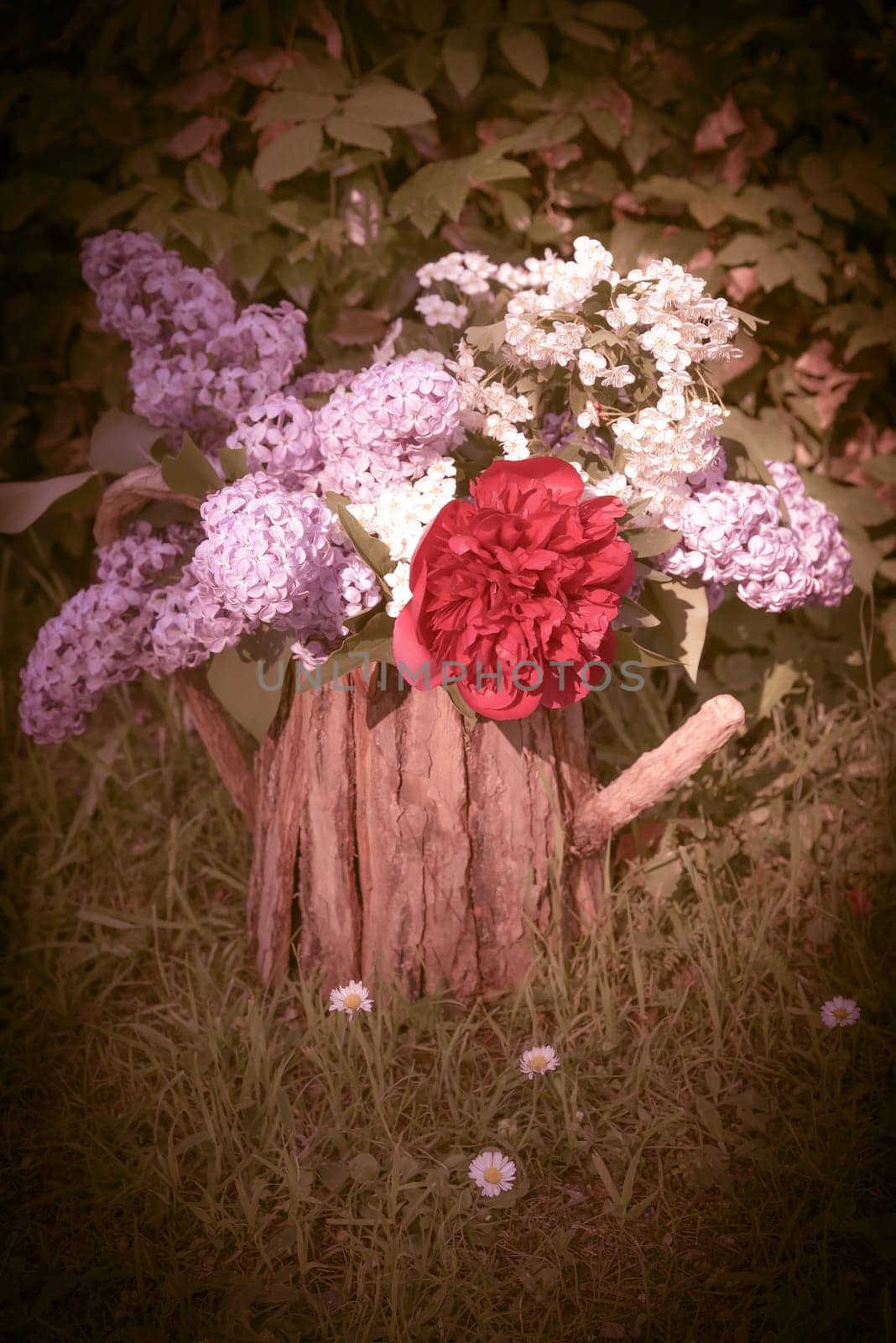 Bouquet with lilac and peony roses.