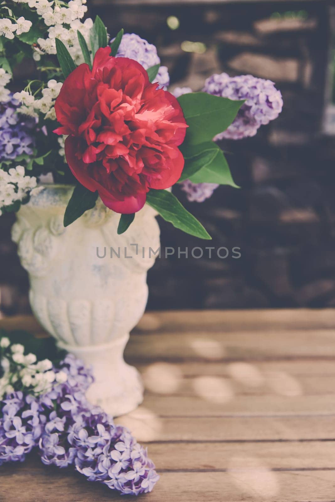 Bouquet with lilac and peony roses.
