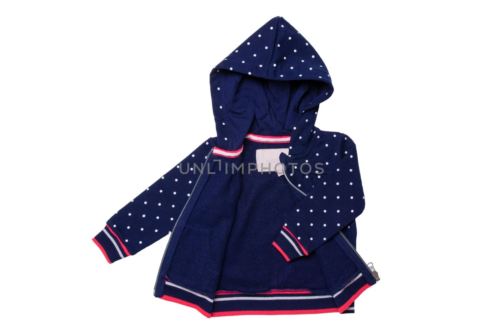 Kids jacket isolated. A stylish fashionable dark blue jacket with white dots and blue lining for the little girl. A sport jacket with hood for jogging isolated on white. Children sport fashion.