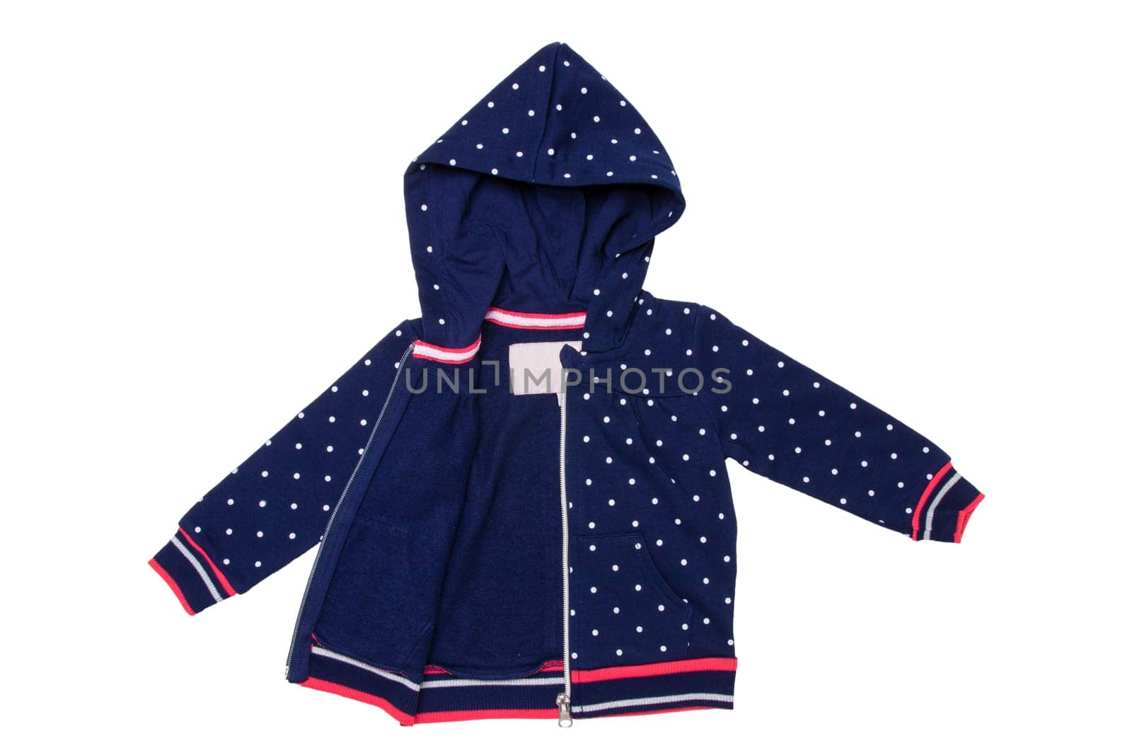 Kids jacket isolated. A stylish fashionable dark blue jacket with white dots and blue lining for the little girl. A sport jacket with hood for jogging isolated on white. Children sport fashion.
