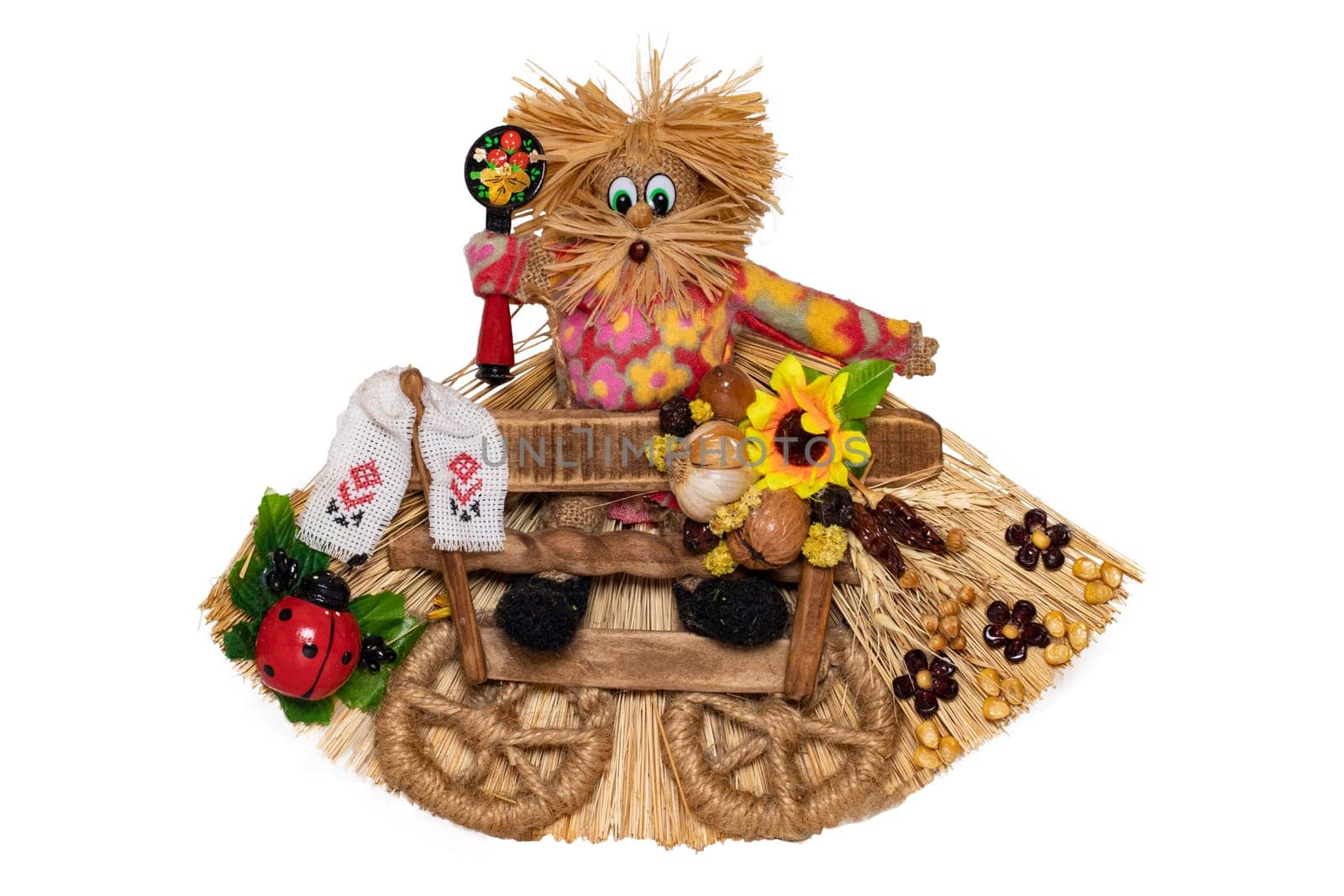 Straw decorations background. Closeup of a traditional ukraine handmade straw figure. It is a symbol for health, vitality and hapiness at home. Traditional ukrainian souvenir.