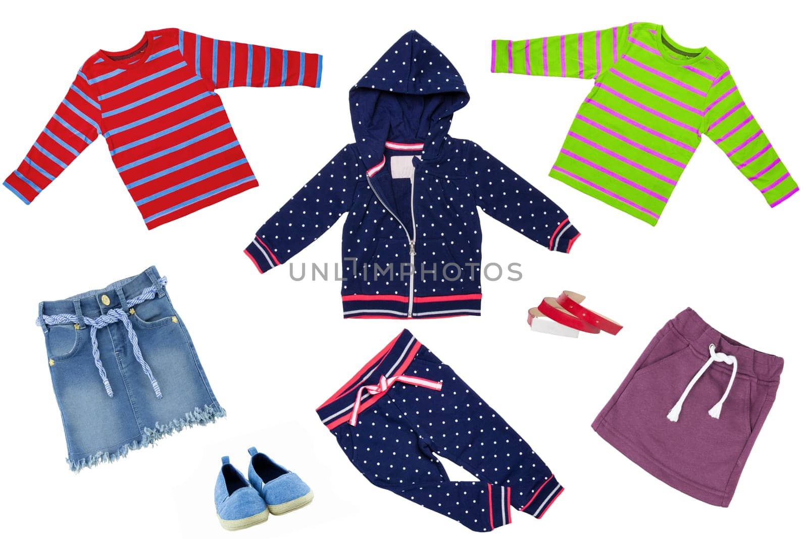 Collage set of little girl clothes isolated on a white background. The collection of a blue jacket with pants, jeans skirt and a pair shoes, two shirts, belt and a other skirt.