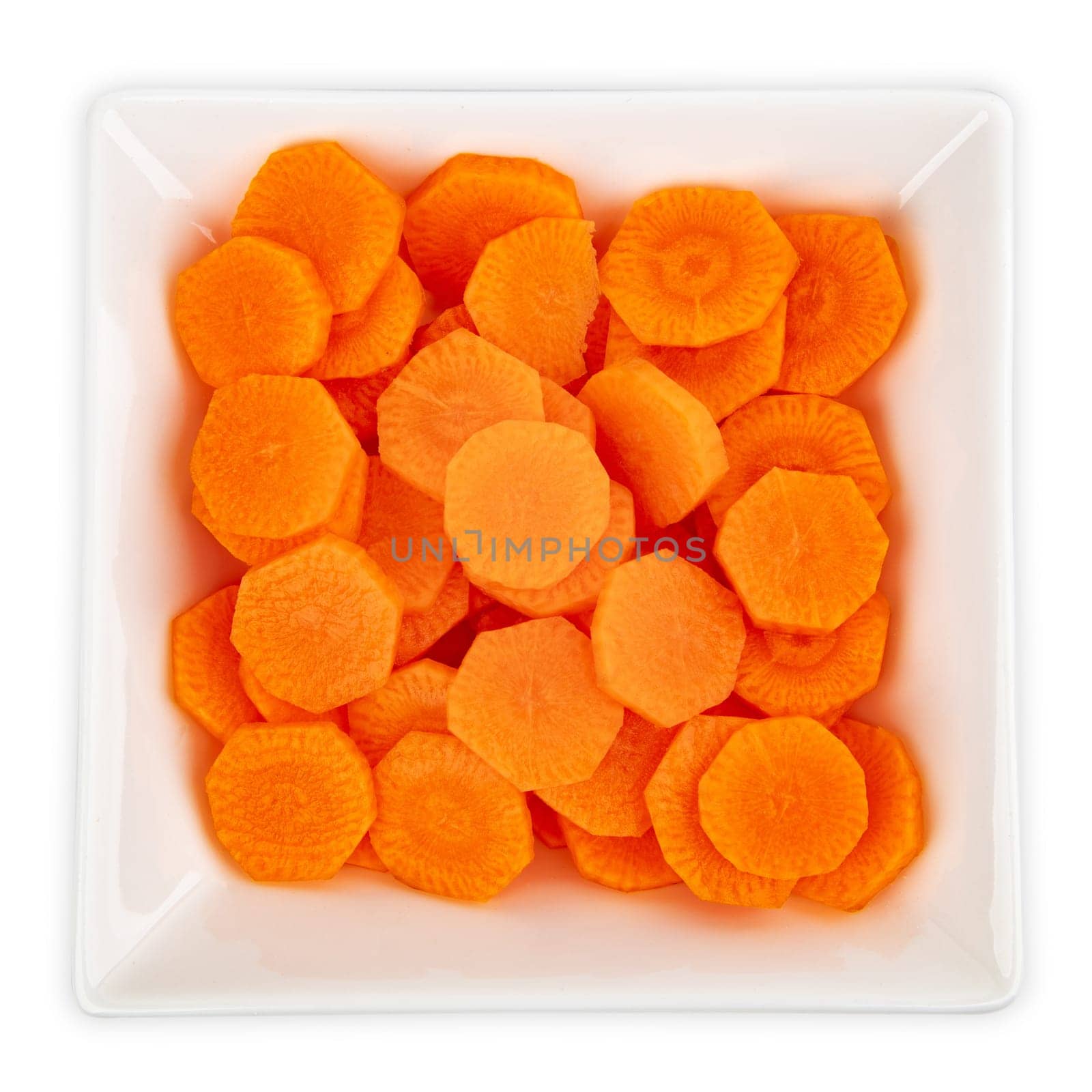 Frish sliced carrots in a bowl isolated on white background