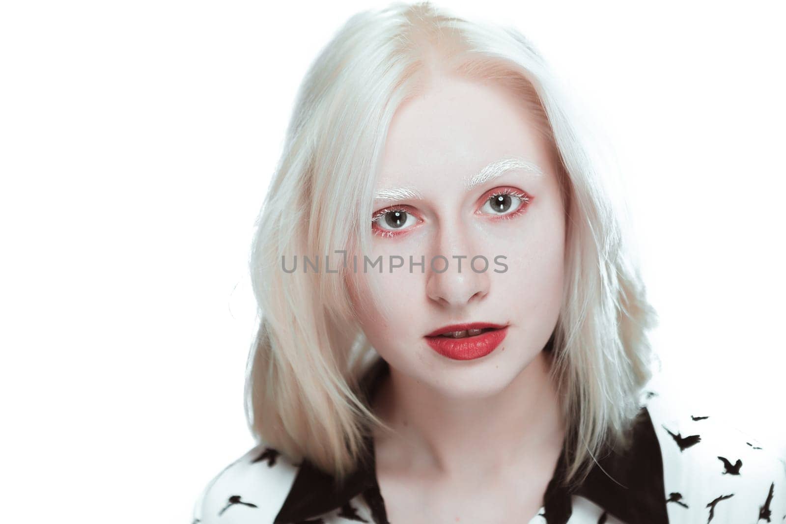 portrait of blonde albino girl in studio.