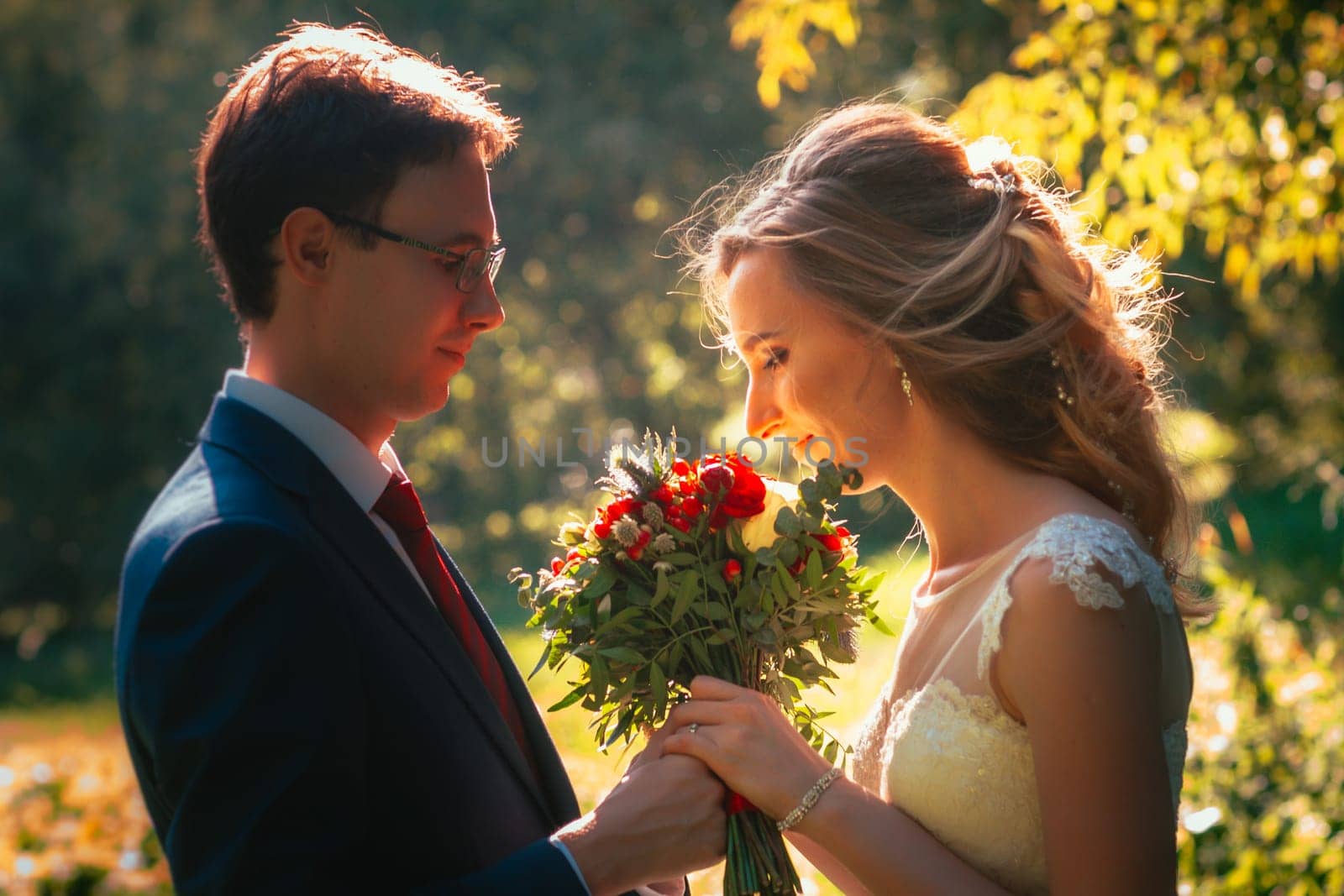 bride and groom on background summer forest.