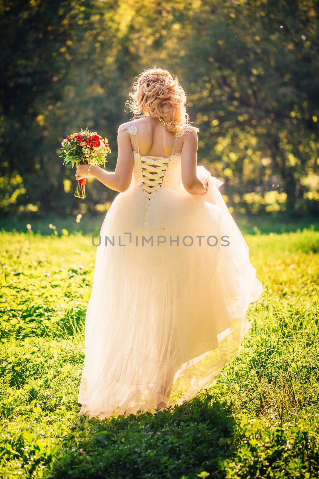 beautiful young bride in the garden background.