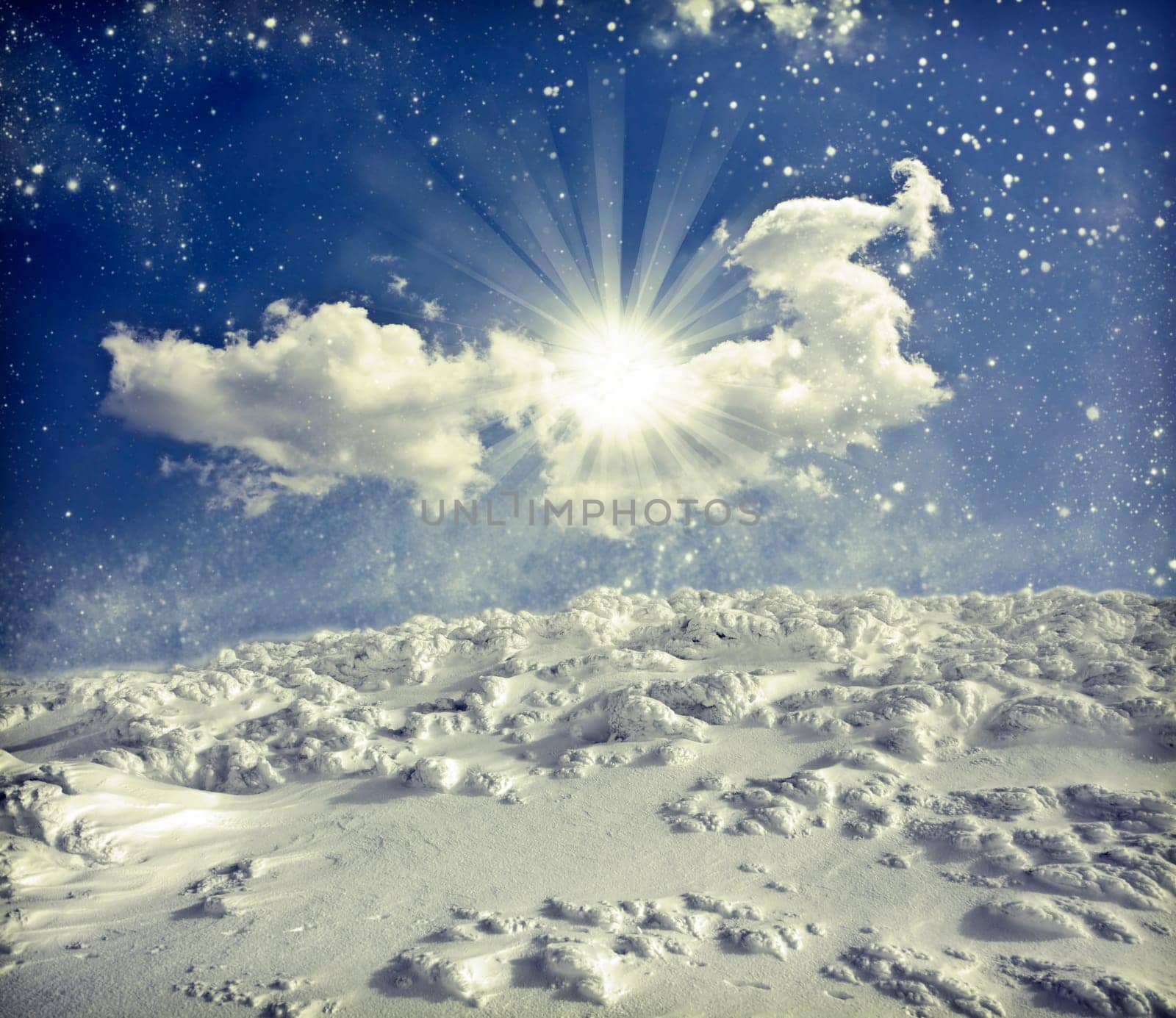 Winter landscape with snow covered hill and cloudy blue sky