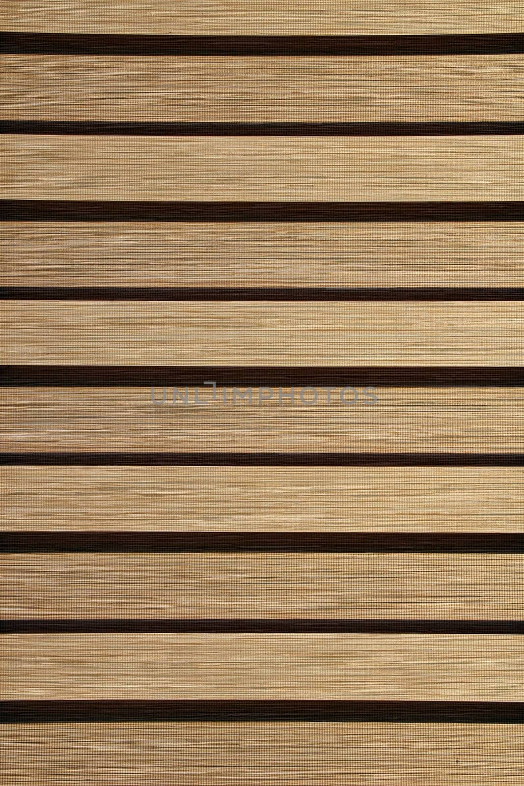 grey strips of jalousie in horizontal position on window. modern blinds in room