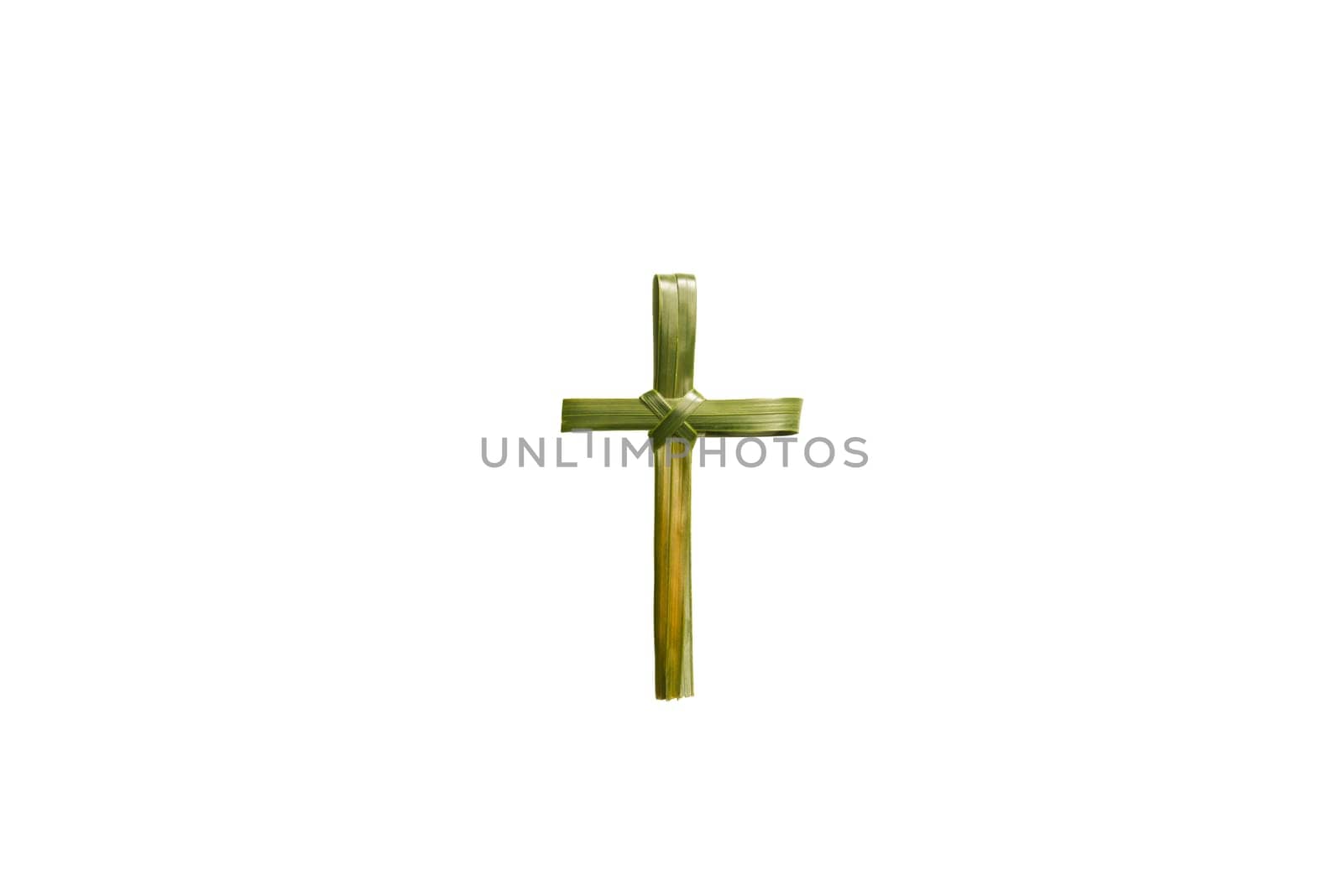 Cross shape of palm leaf isolated over white background. Palm Sunday concept