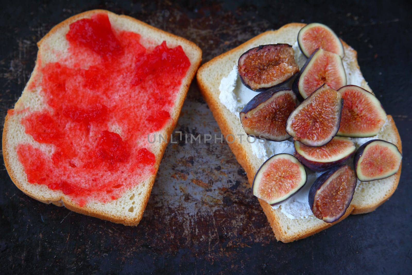 White bread with soft cream cheese, fresh figs and raspberry jam