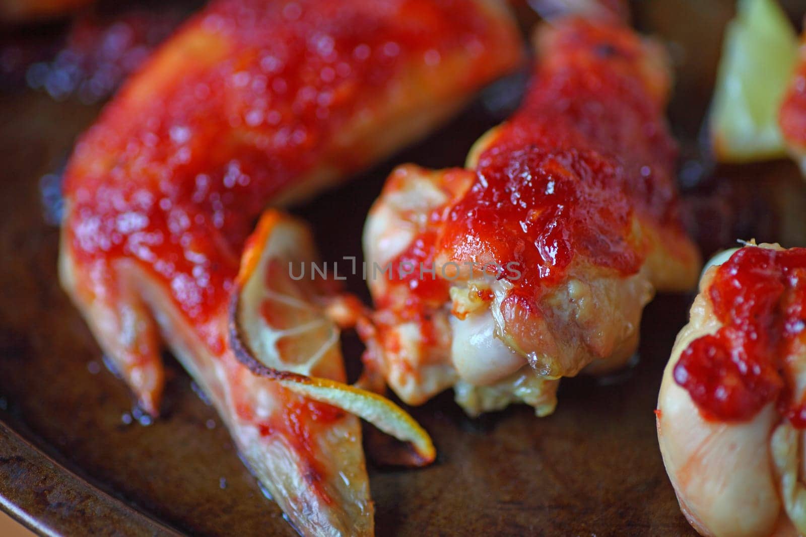 Chicken wings with barbecue sauce and lemon