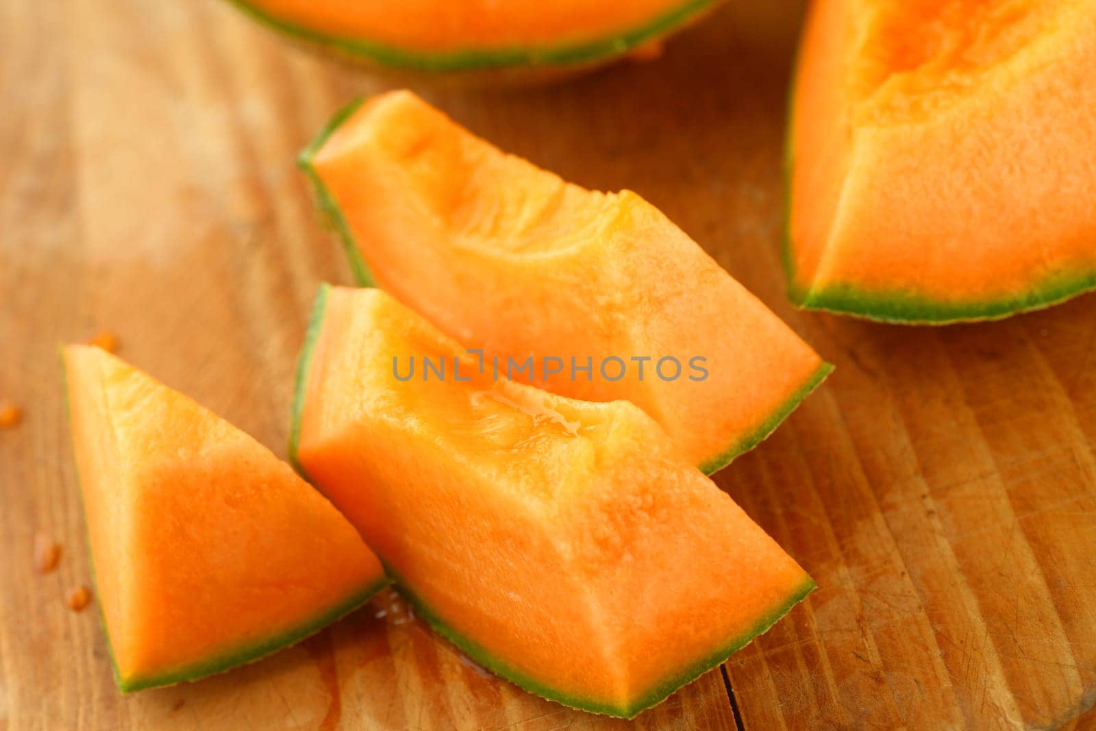Closeup of juicy melon on a cutting board