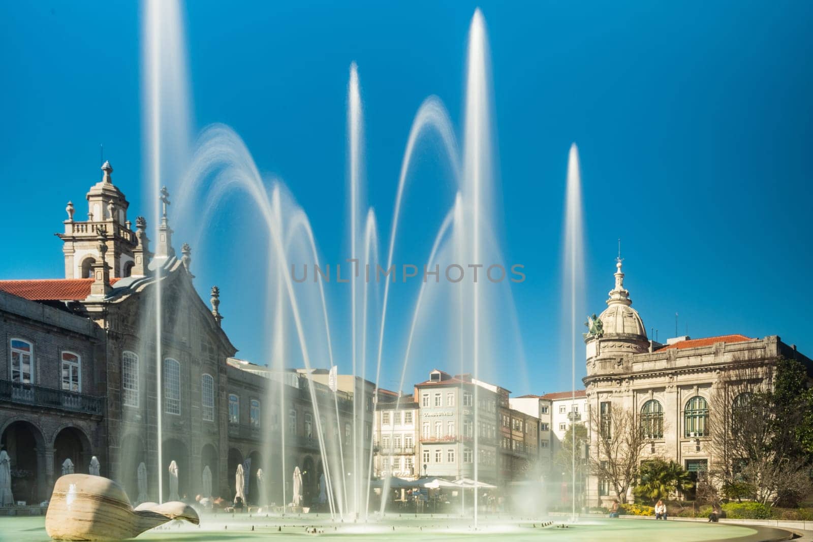 BRAGA, PORTUGAL - CIRCA FEBRUARY 2019: Fountains at Medieval Republic Square or Praca da Republica known as Arcade. Braga urban cityscape, one of the oldest cities of Portugal.