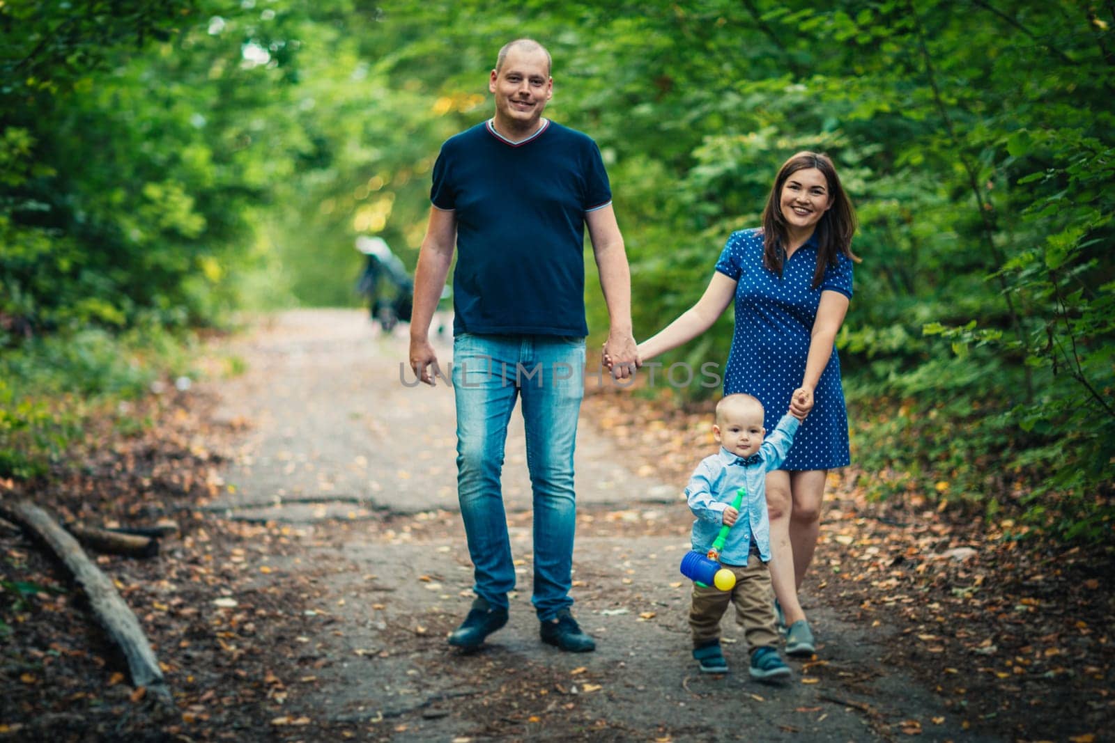 happy family with son on background forest