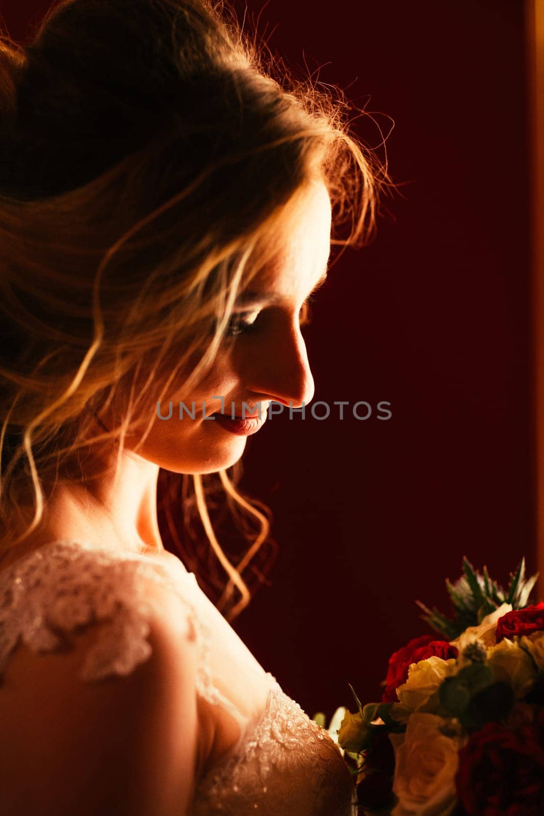 Portrait young beauty bride near the window.