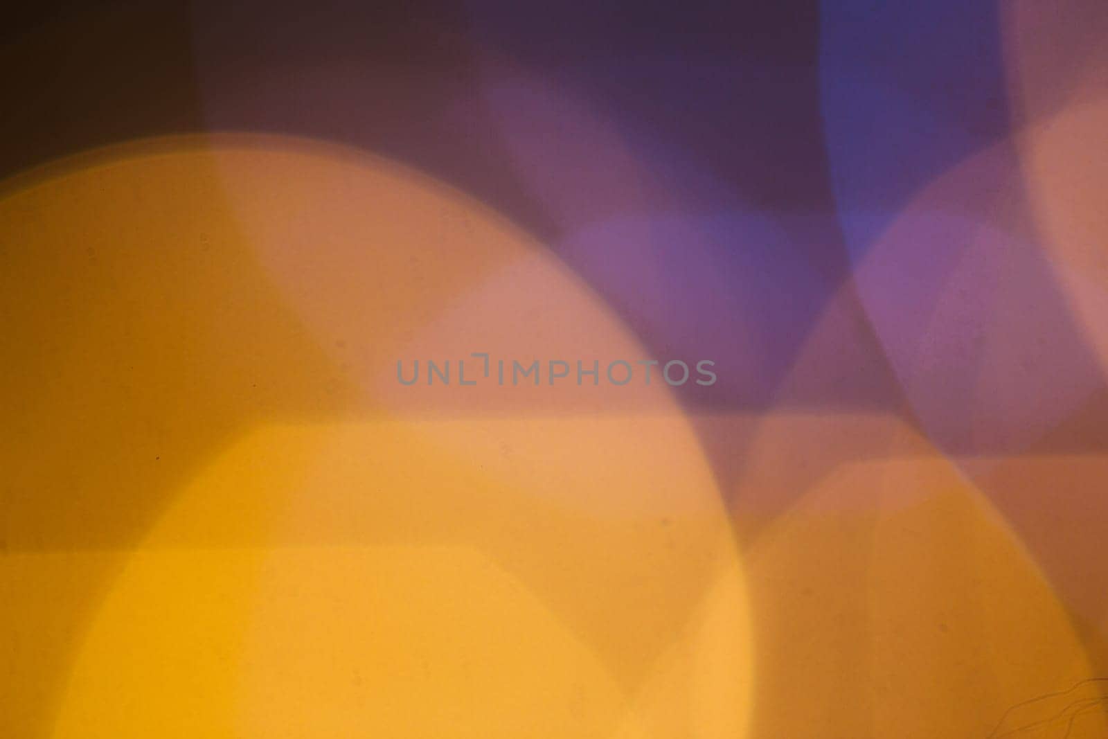 large gold and silver bokeh on a dark background.