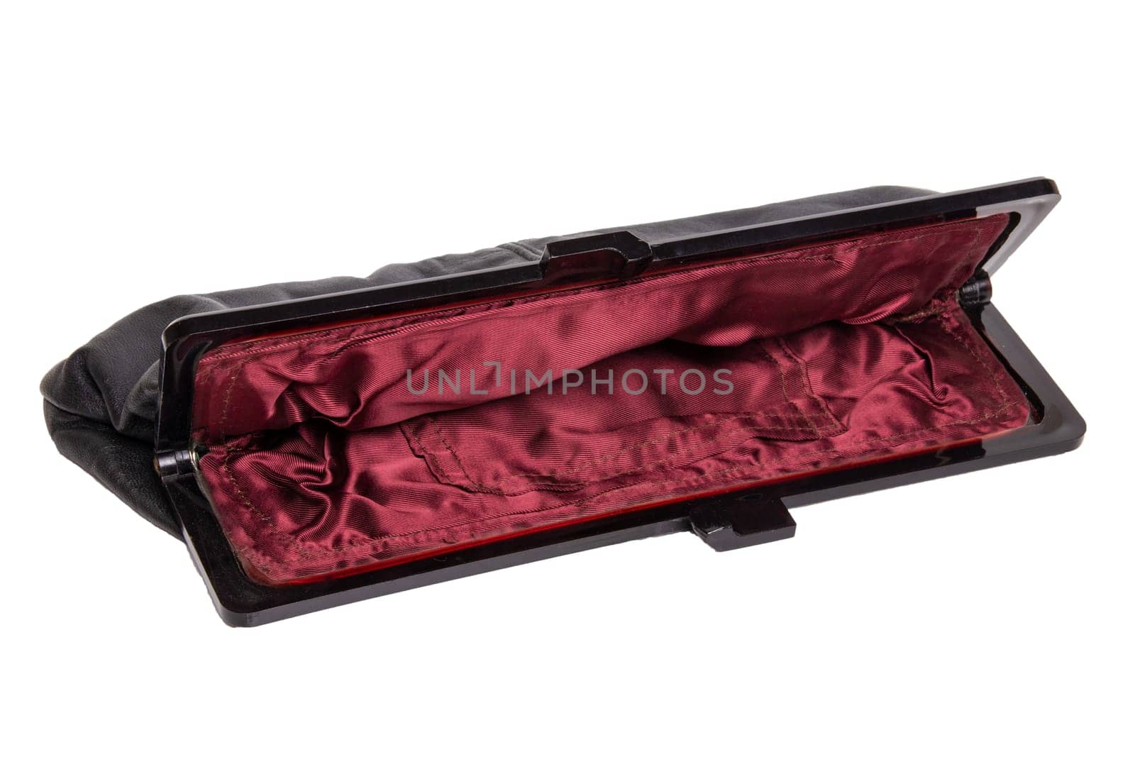 Vintage bags. A black elegant ladies handbag of the fifties isolated on a white background. A stylish handbag for the evening or for the opera. Vintage fashion.