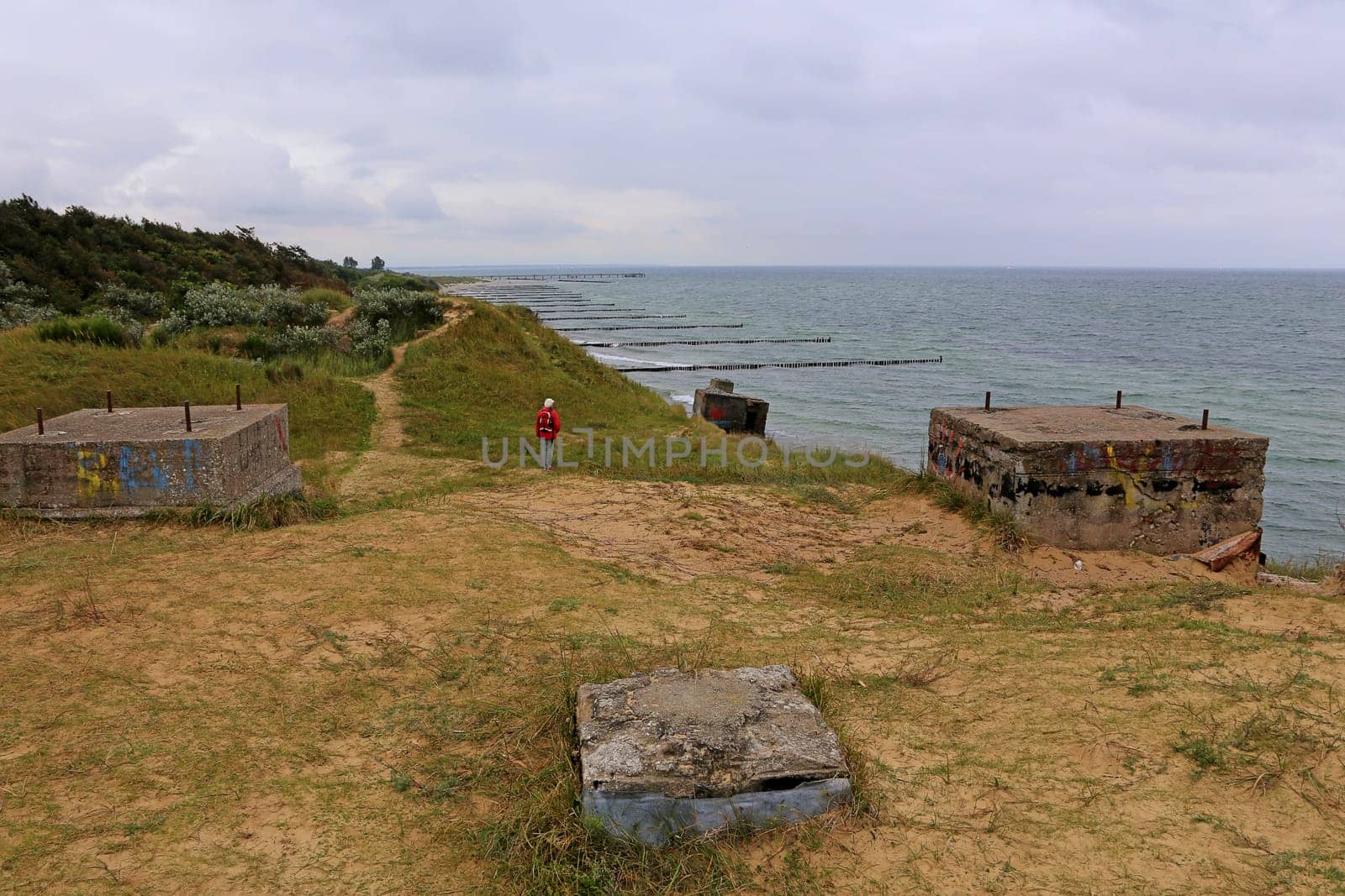 Steep coast with old bunkers on the coast of Niehagen