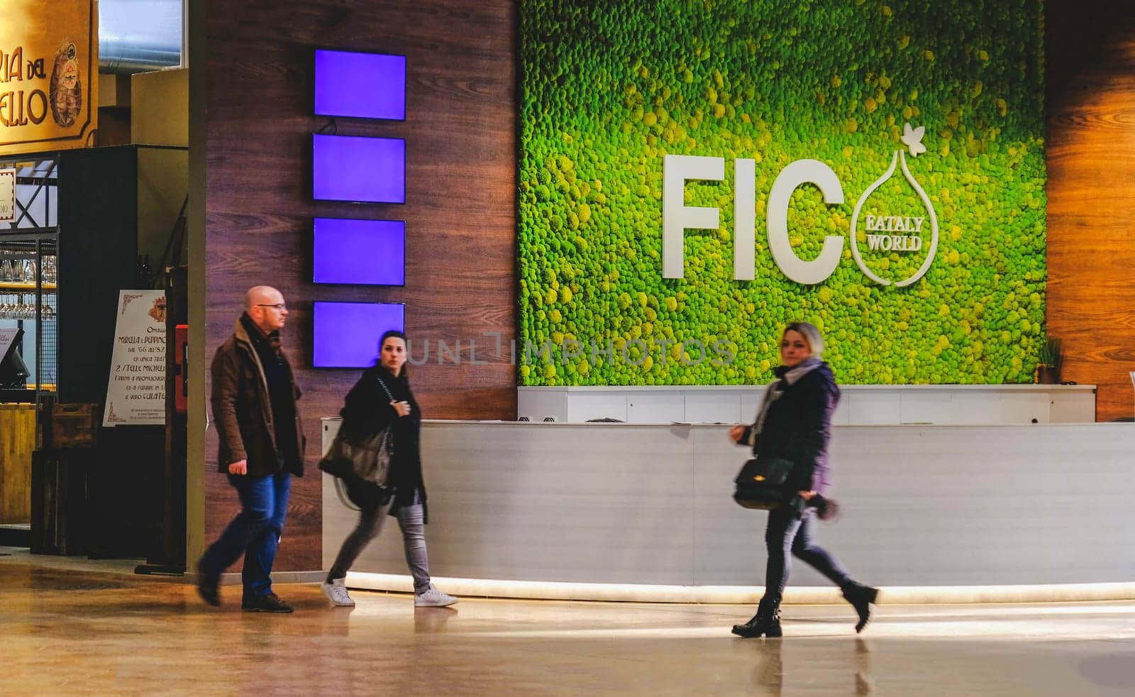 people at Fico Eataly World pass near the Fico help desk in Bologna, Italy, 24 Feb 2019