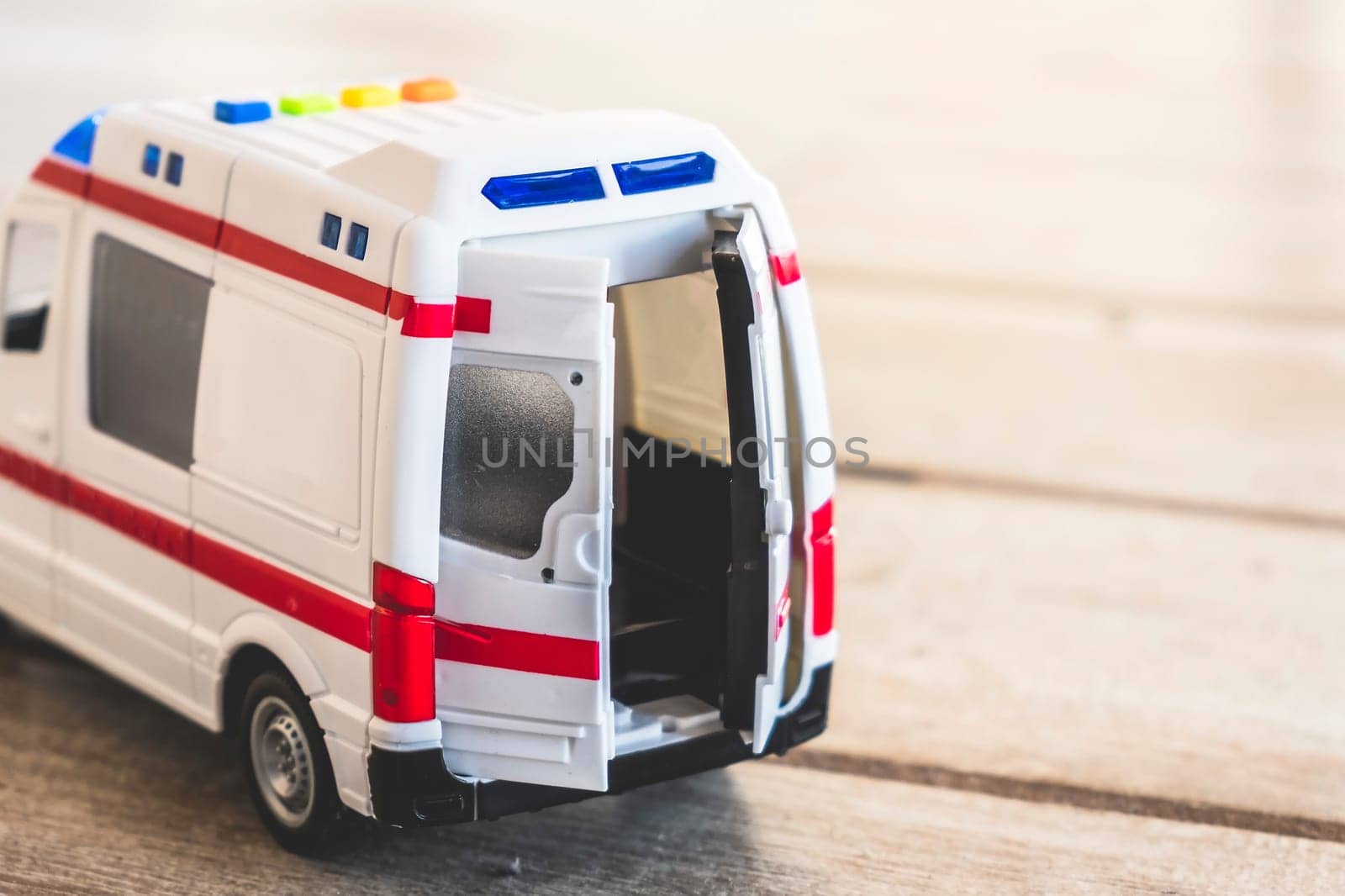 Bologna, Italy, 11 Jan 2018 - ILLUSTRATIVE EDITORIAL of ambulance doors background health care toy close up .