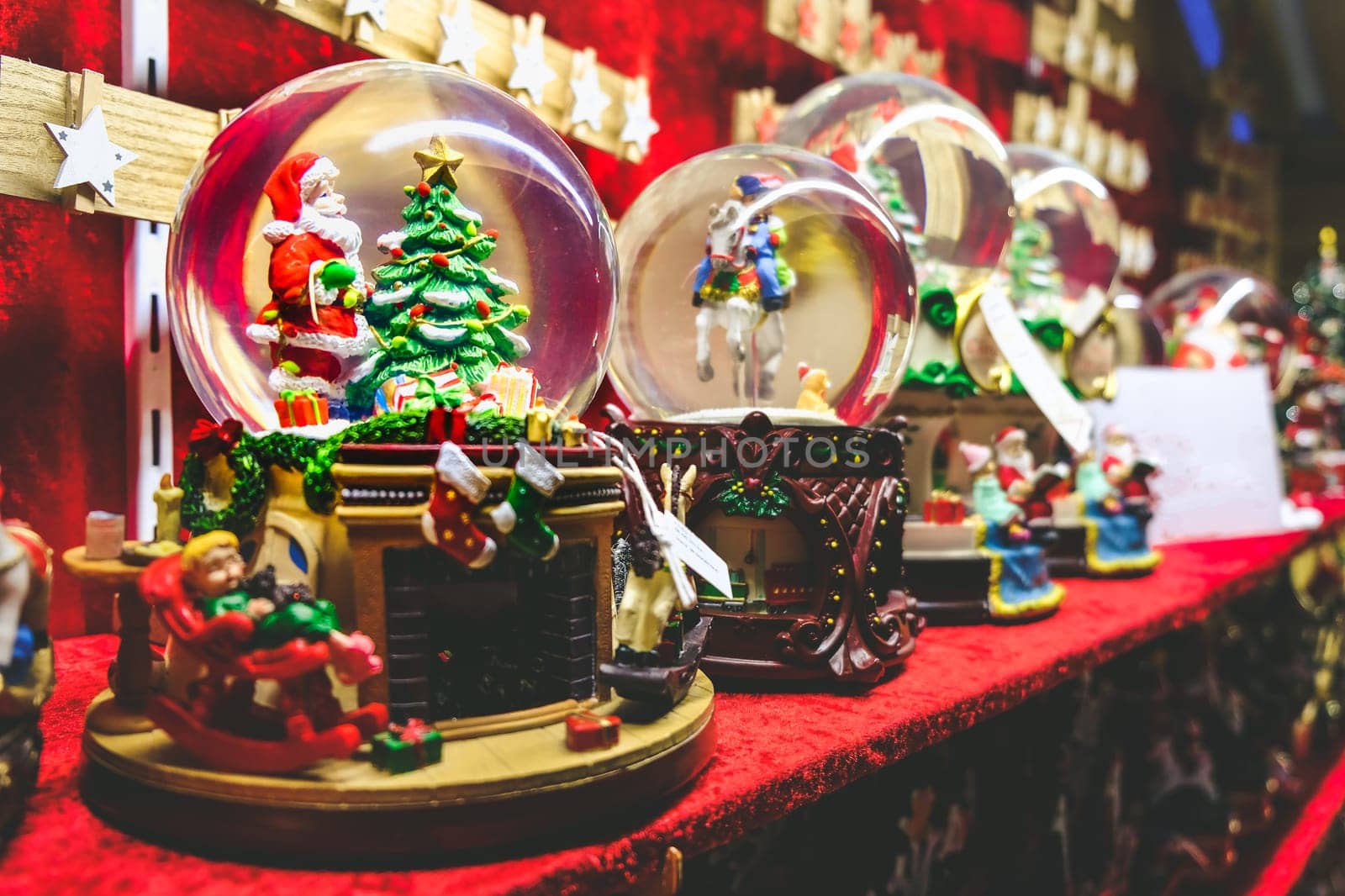christmas snow globe background crystal ball with santa claus and christmas tree inside .