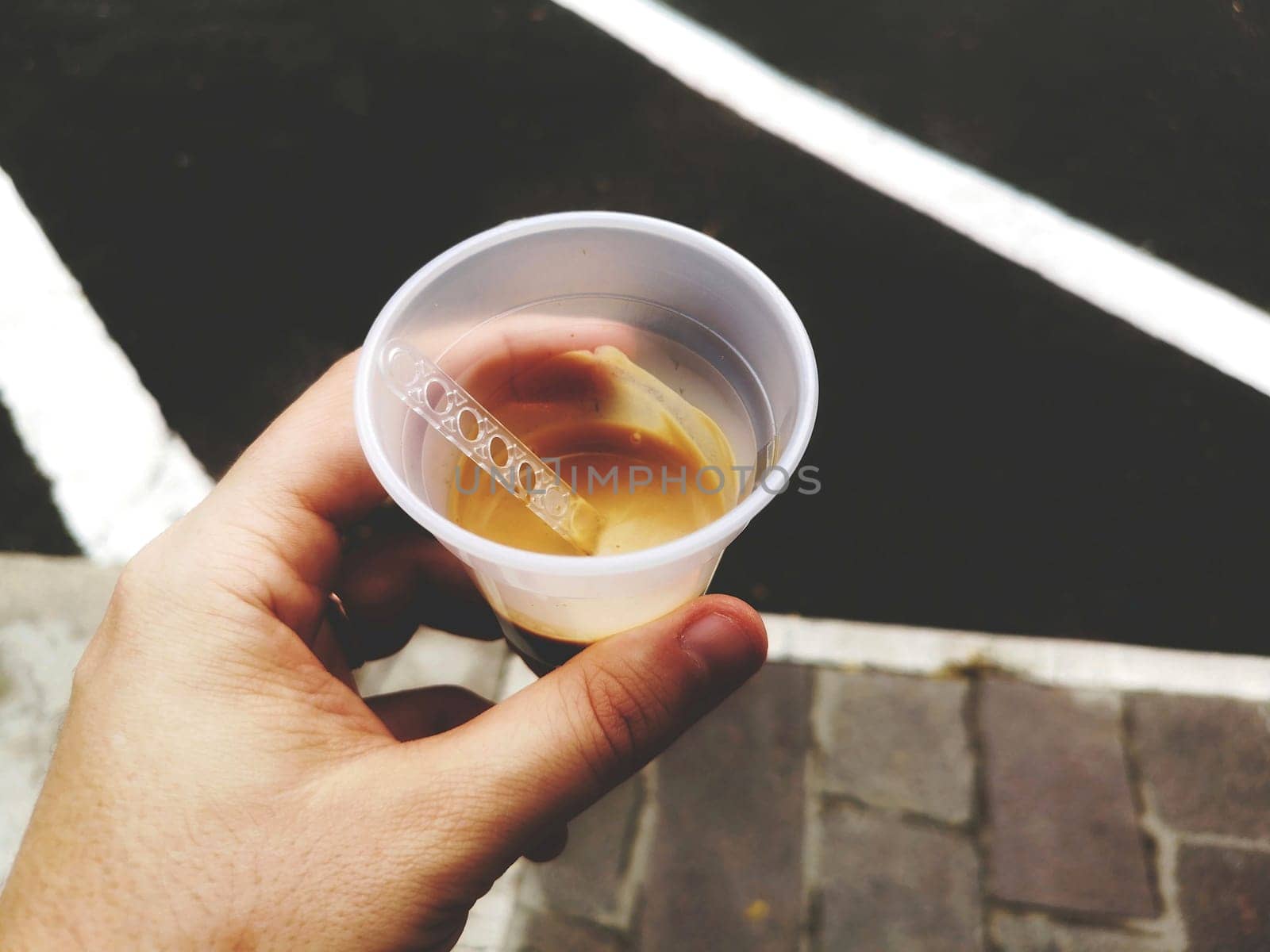 hand coffee break at work - espresso vending machine plastic cup glass .