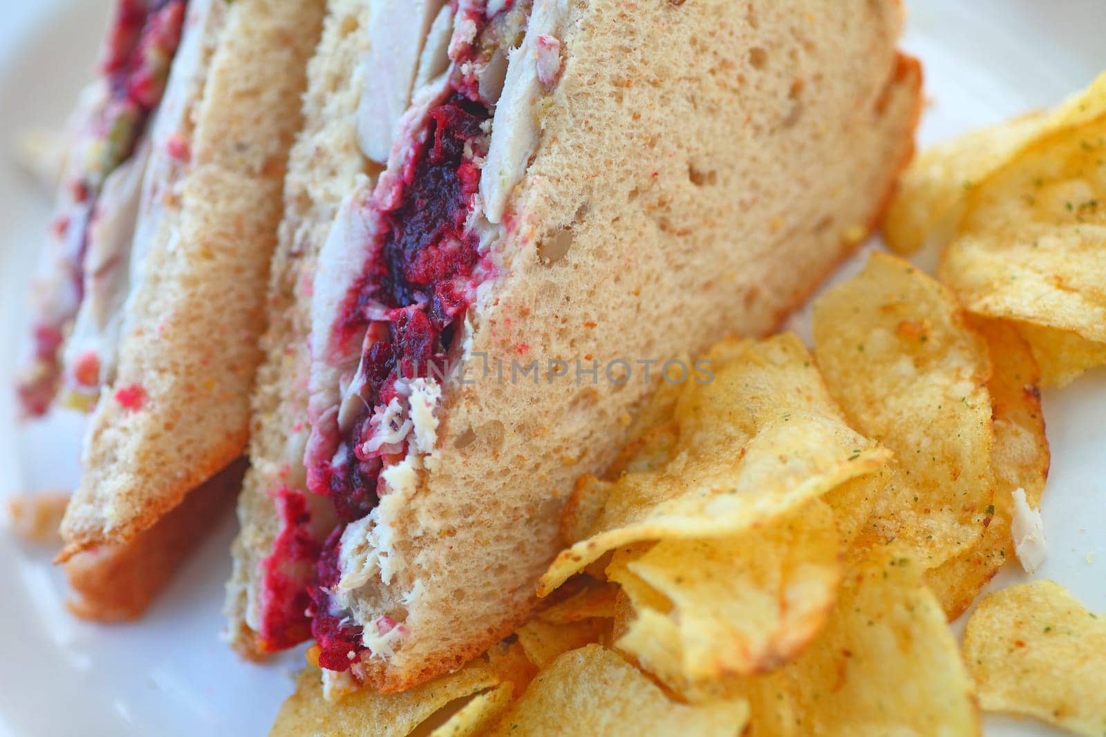 Turkey sandwich cut in half with stuffing-flavored potato chips