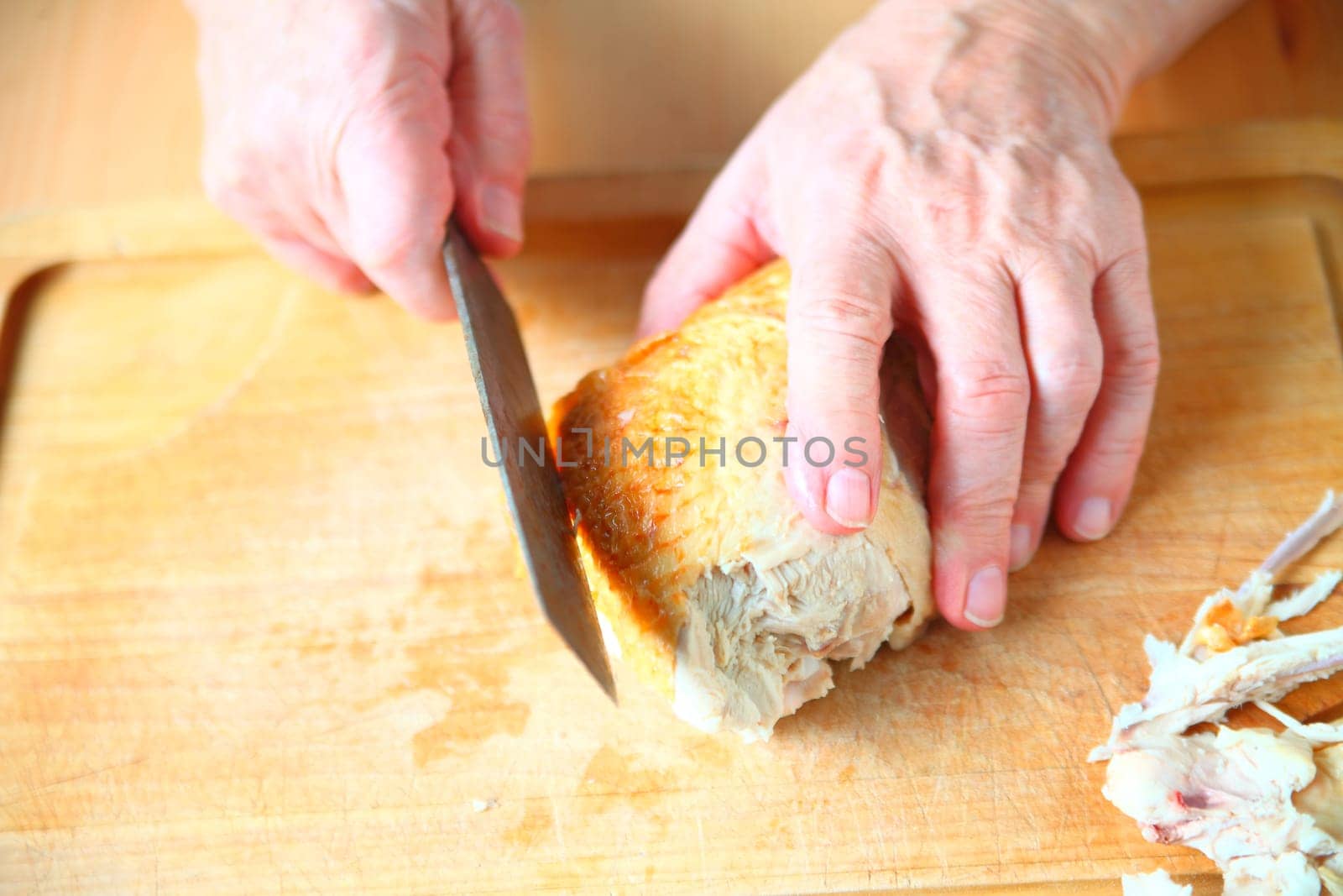 A man ready to slice a Thanksgiving turkey breast
