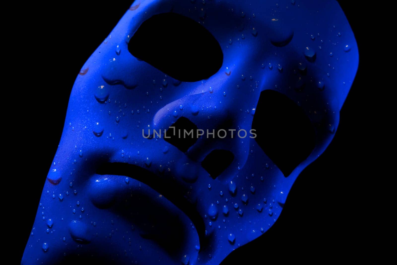 Blank robot face with blue water texture for skin. AI concept with close up human like features. Black background.