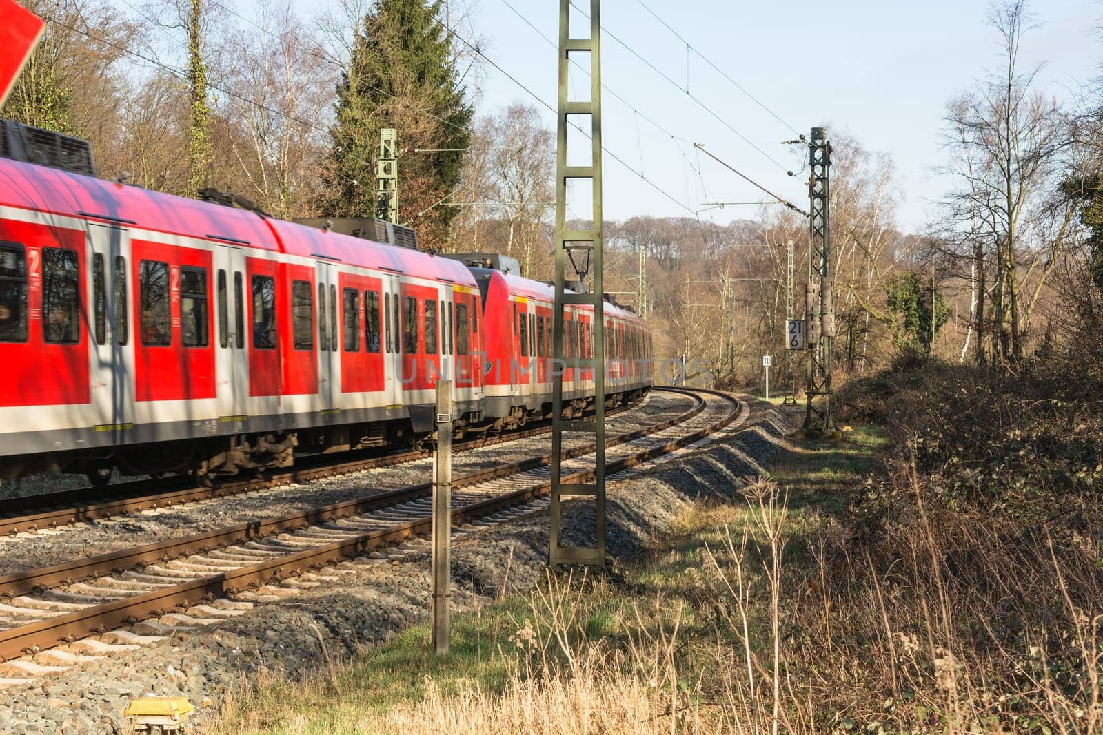 ESSEN KETTWIG, NRW, GERMANY - FEBRUAR 12, 2016:.Level crossing in Essen Kettwig an der Ruhr on Kattenturm..In driving, railway train toward Duesseldorf.
