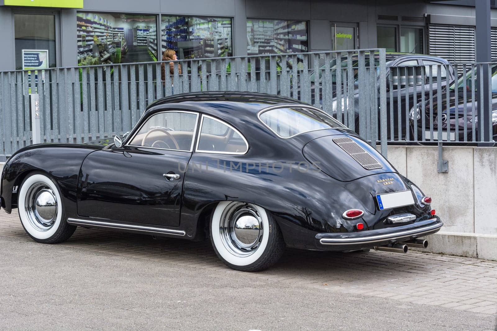 VELBERT, NRW, GERMANY - APRIL 06, 2016:.Black vintage Porsche 1600 with whitewall tires on a car park in Velbert city center, Germany...