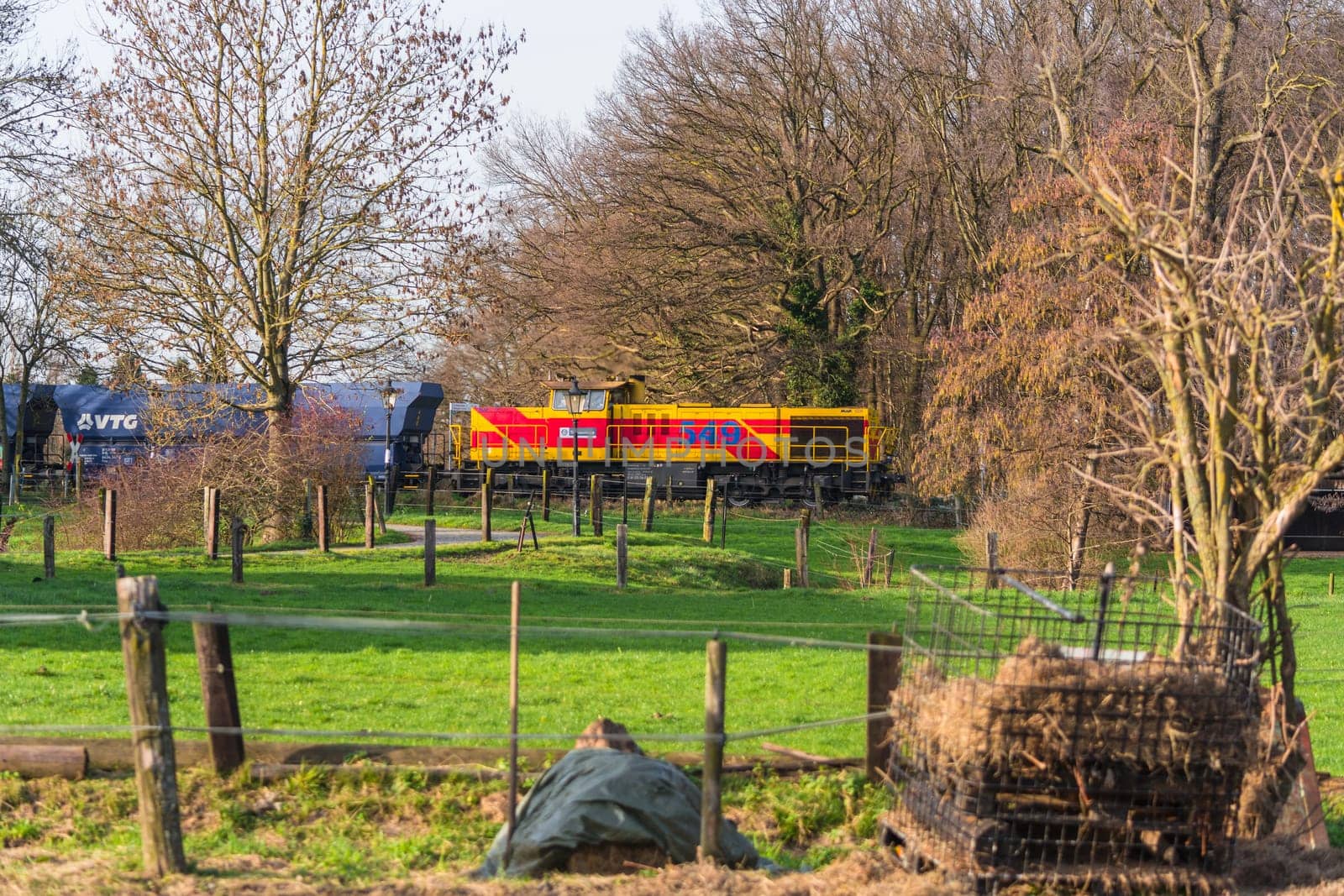 RATINGEN, NRW, GERMANY - DECEMBER 28, 2015:.Locomotive at the railroad crossing in Ratingen at the moated castle "house to house"". By propelled fast train towards Muelheim - food."