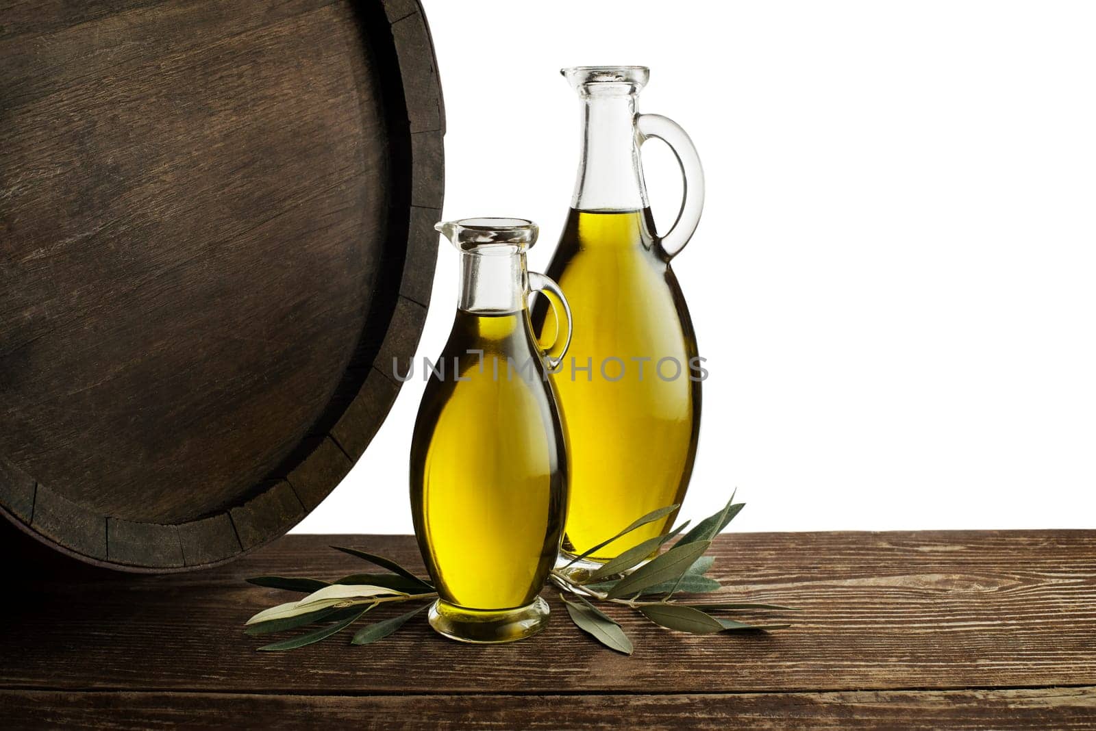 Bottle of Extra virgin healthy Olive oil with barrel on white background