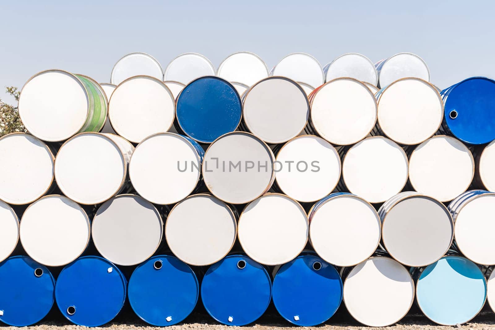 Industry oil chemical metal barrels stacked up in waste yard of tank and container, Kawasaki city near Tokyo Japan